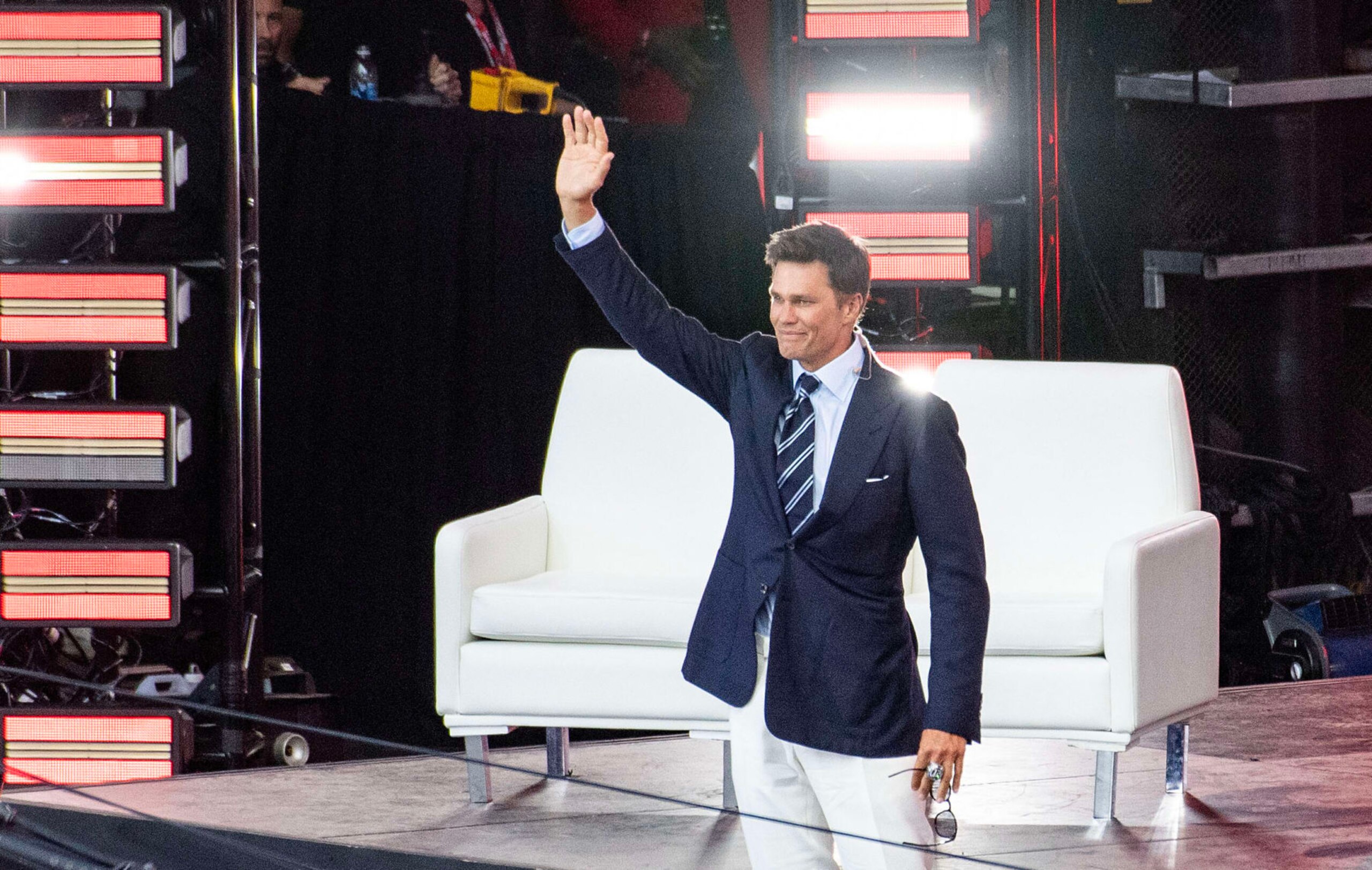 Former New England Patriots quarterback Tom Brady waves from stage during his 2024 Hall of Fame induction ceremony at Gillette Stadium in Foxborough, Massachusetts, on June 12, 2024. (Photo by Joseph Prezioso / AFP) (Photo by JOSEPH PREZIOSO/AFP via Getty Images)