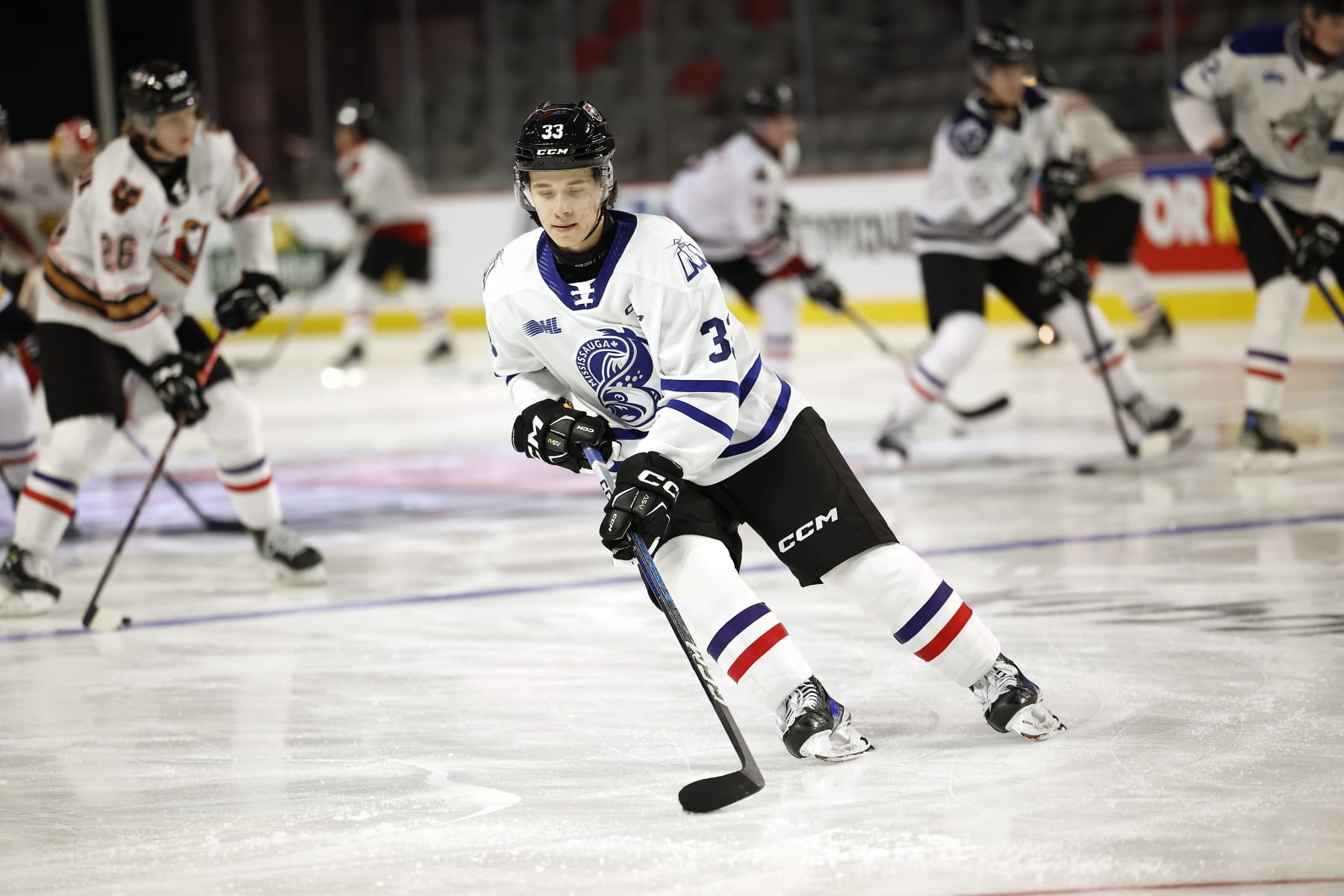 MONCTON, CANADA - JANUARY 23:   Luke Misa #33 of Team White stick handles the puck during practice session of 2024 Kabota Top Prospects game at Avenir Centre on January 23, 2024 in Moncton, Canada. (Photo by Dale Preston/Getty Images)