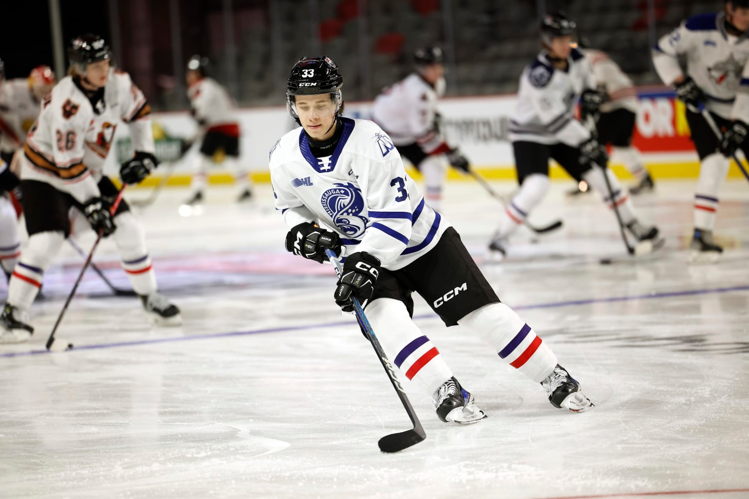 MONCTON, CANADA - JANUARY 23:   Luke Misa #33 of Team White stick handles the puck during practice session of 2024 Kabota Top Prospects game at Avenir Centre on January 23, 2024 in Moncton, Canada. (Photo by Dale Preston/Getty Images)