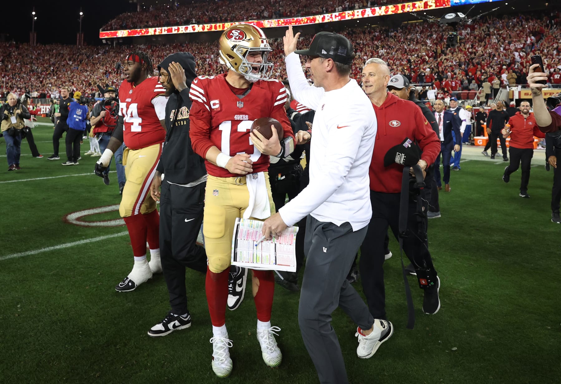 SANTA CLARA, CALIFORNIA - JANUARY 28: Brock Purdy #13 of the San Francisco 49ers celebrates with Head coach Kyle Shanahan  after defeating the Detroit Lions 34-31 in the NFC Championship Game at Levi's Stadium on January 28, 2024 in Santa Clara, California. (Photo by Ezra Shaw/Getty Images)
