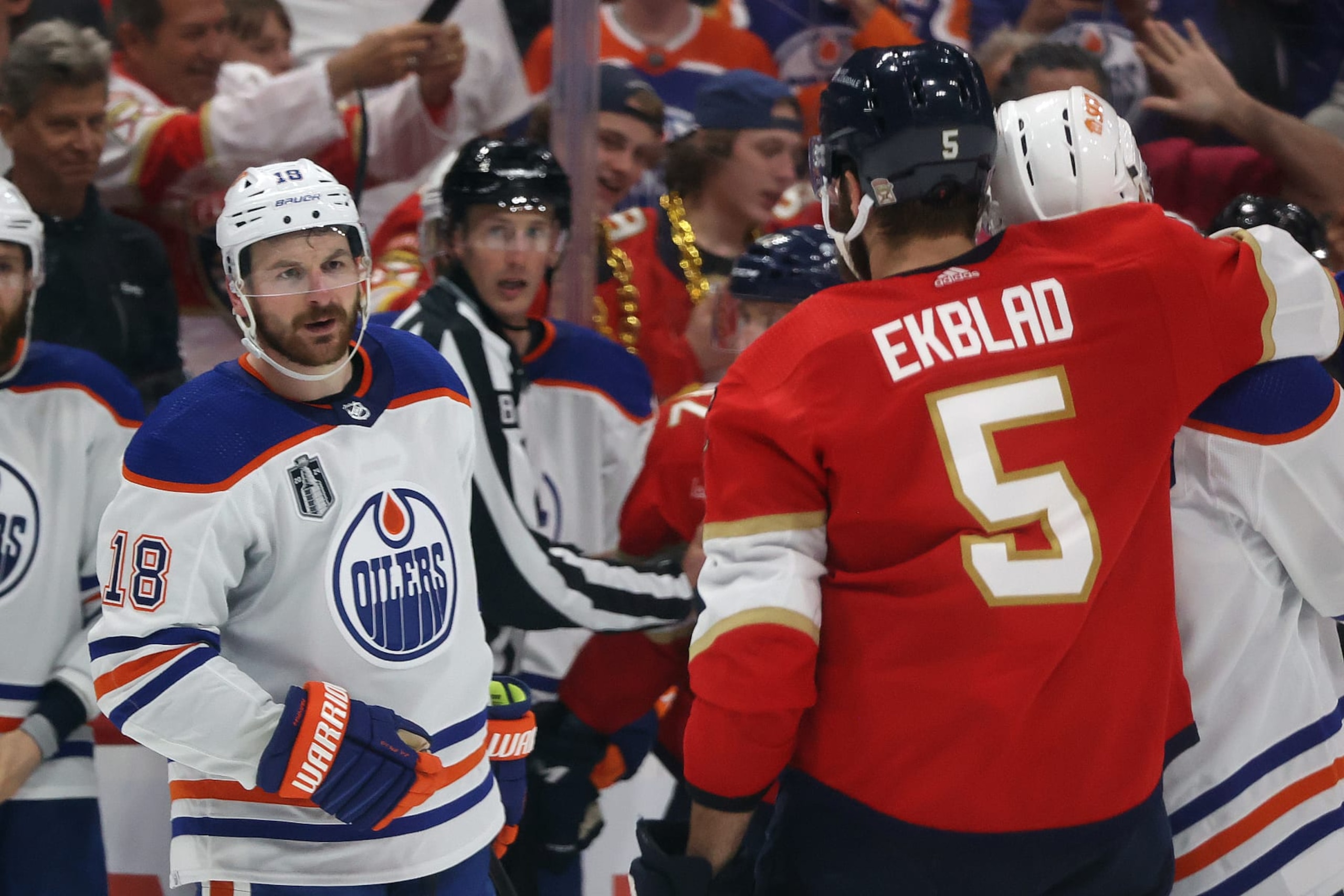 SUNRISE, FL - JUNE 10: Zach Hyman #18 of the Edmonton Oilers Aaron Ekblad #5 of the Florida Panthers exchange words during third period action in Game Two of the Final of the 2024 Stanley Cup Playoffs at the Amerant Bank Arena on June 10, 2024 in Sunrise, Florida. (Photo by Joel Auerbach/Getty Images) SUNRISE, FL - JUNE 10: Zach Hyman #18 of the Edmonton Oilers Aaron Ekblad #5 of the Florida Panthers exchange words during third period action in Game Two of the Final of the 2024 Stanley Cup Playoffs at the Amerant Bank Arena on June 10, 2024 in Sunrise, Florida. (Photo by Joel Auerbach/Getty Images)