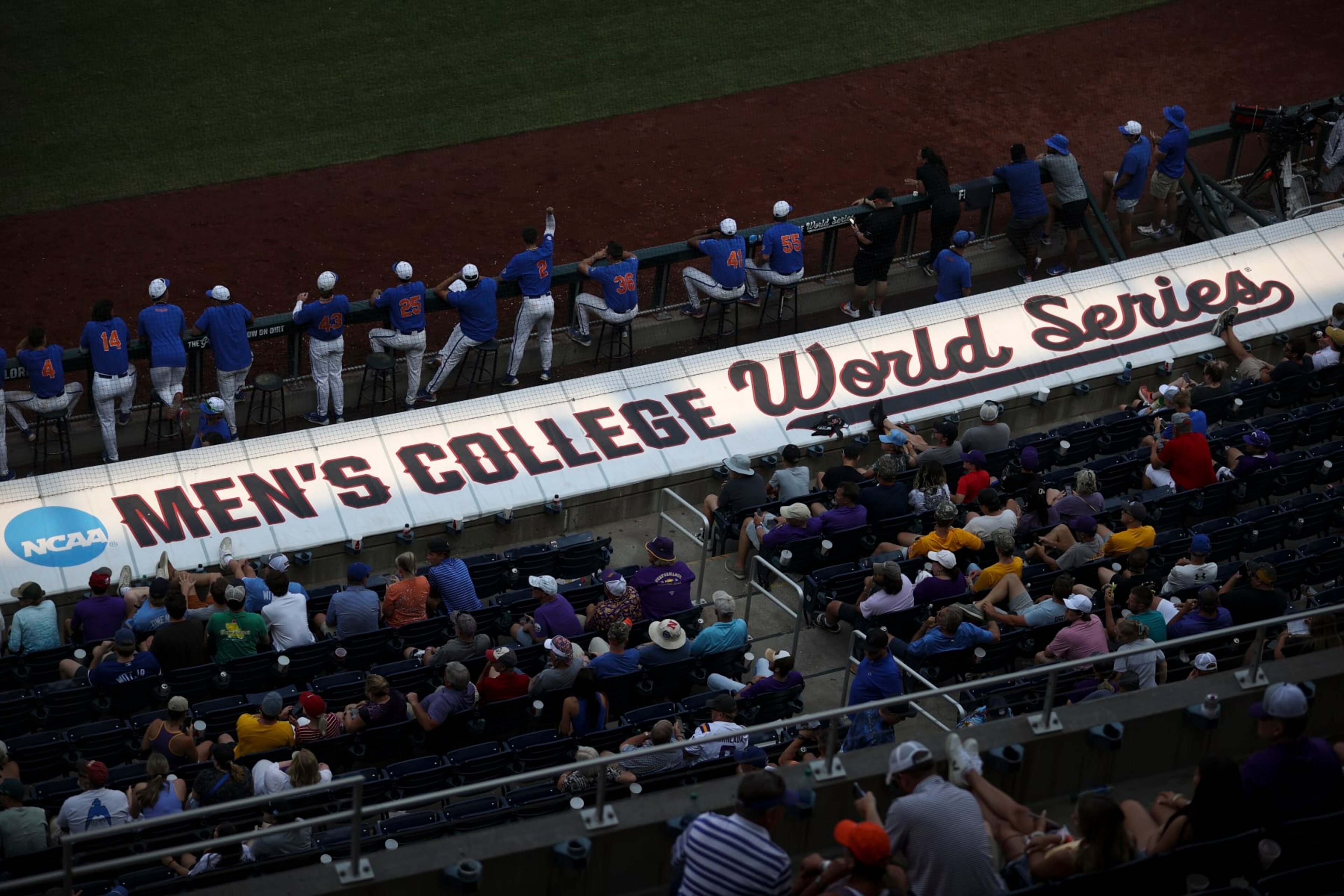OMAHA, NE - JUNE 25: The Mens College World Series logo is illuminated but the setting sun during Game 2 of the Division I Mens Baseball Championship finals between the LSU Tigers and the Florida Gators held at Charles Schwab Field on June 25, 2023 in Omaha, Nebraska. (Photo by Tyler Schank/NCAA Photos via Getty Images)