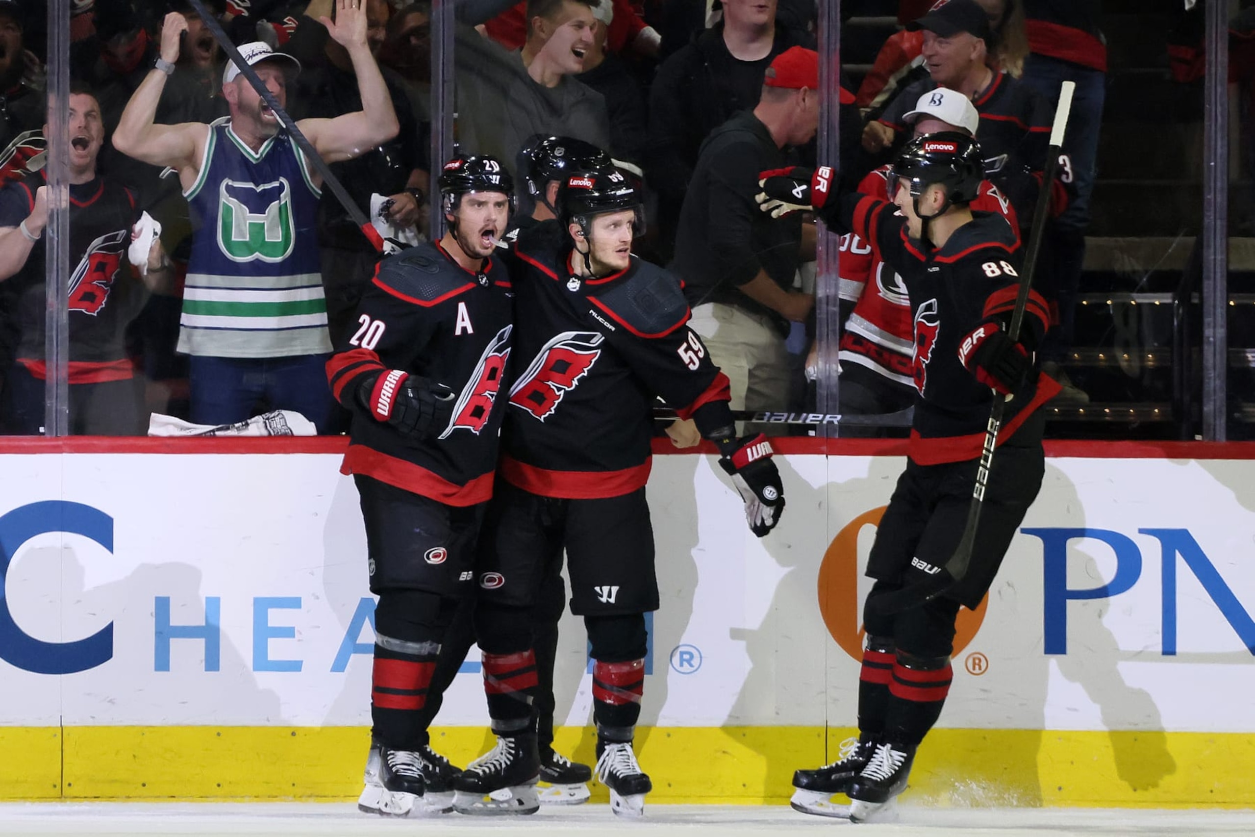 Carolina Hurricanes forwards Sebastian Aho (left), Jake Guentzel and Martin NeÄas celebrate a goal. Carolina Hurricanes forwards Sebastian Aho (left), Jake Guentzel and Martin NeÄas celebrate a goal.