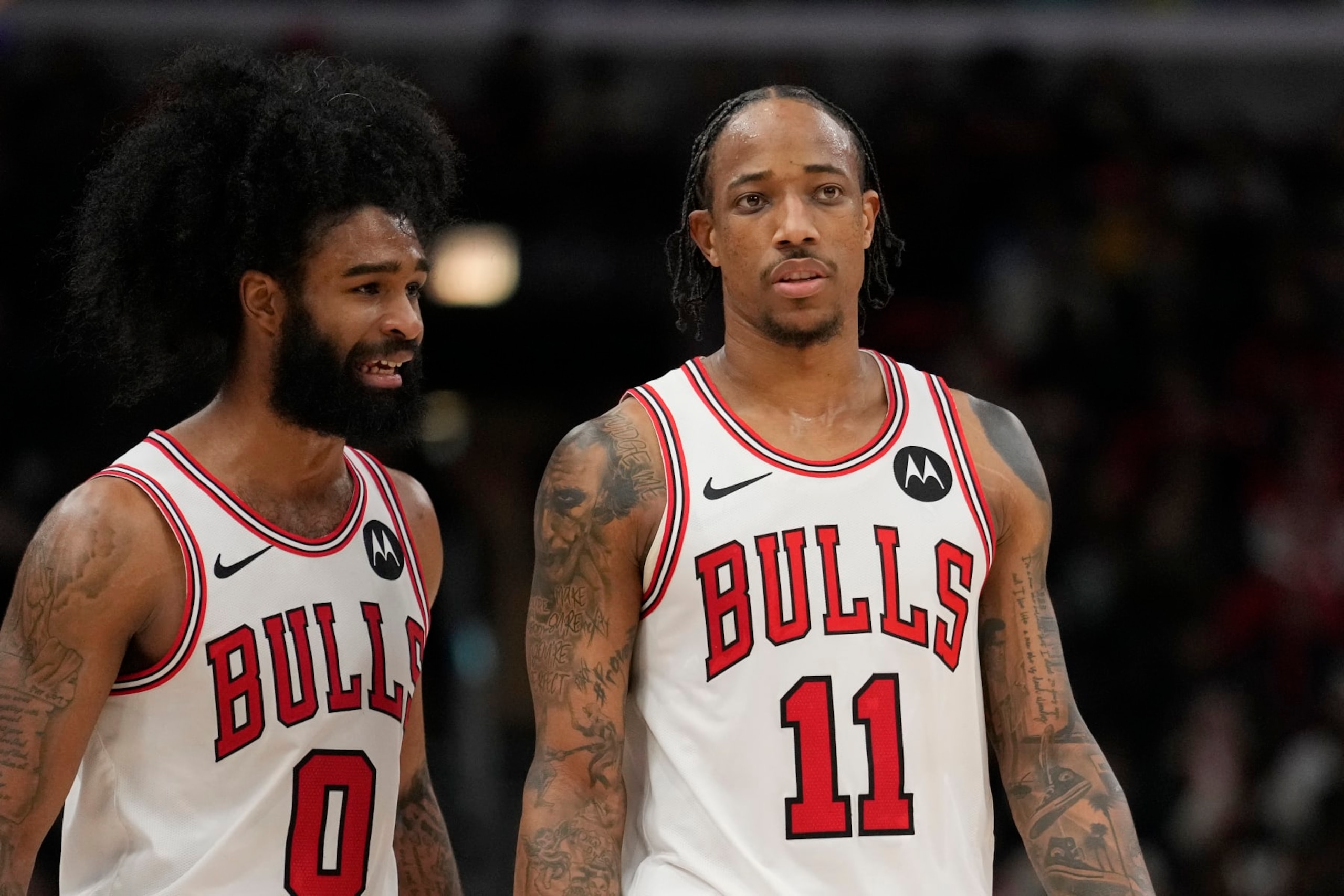 CHICAGO, ILLINOIS - MARCH 27: Coby White #0 and DeMar DeRozan #11 of the Chicago Bulls talk during the second half against the Indiana Pacers at the United Center on March 27, 2024 in Chicago, Illinois. NOTE TO USER: User expressly acknowledges and agrees that, by downloading and or using this photograph, User is consenting to the terms and conditions of the Getty Images License Agreement. (Photo by Patrick McDermott/Getty Images)