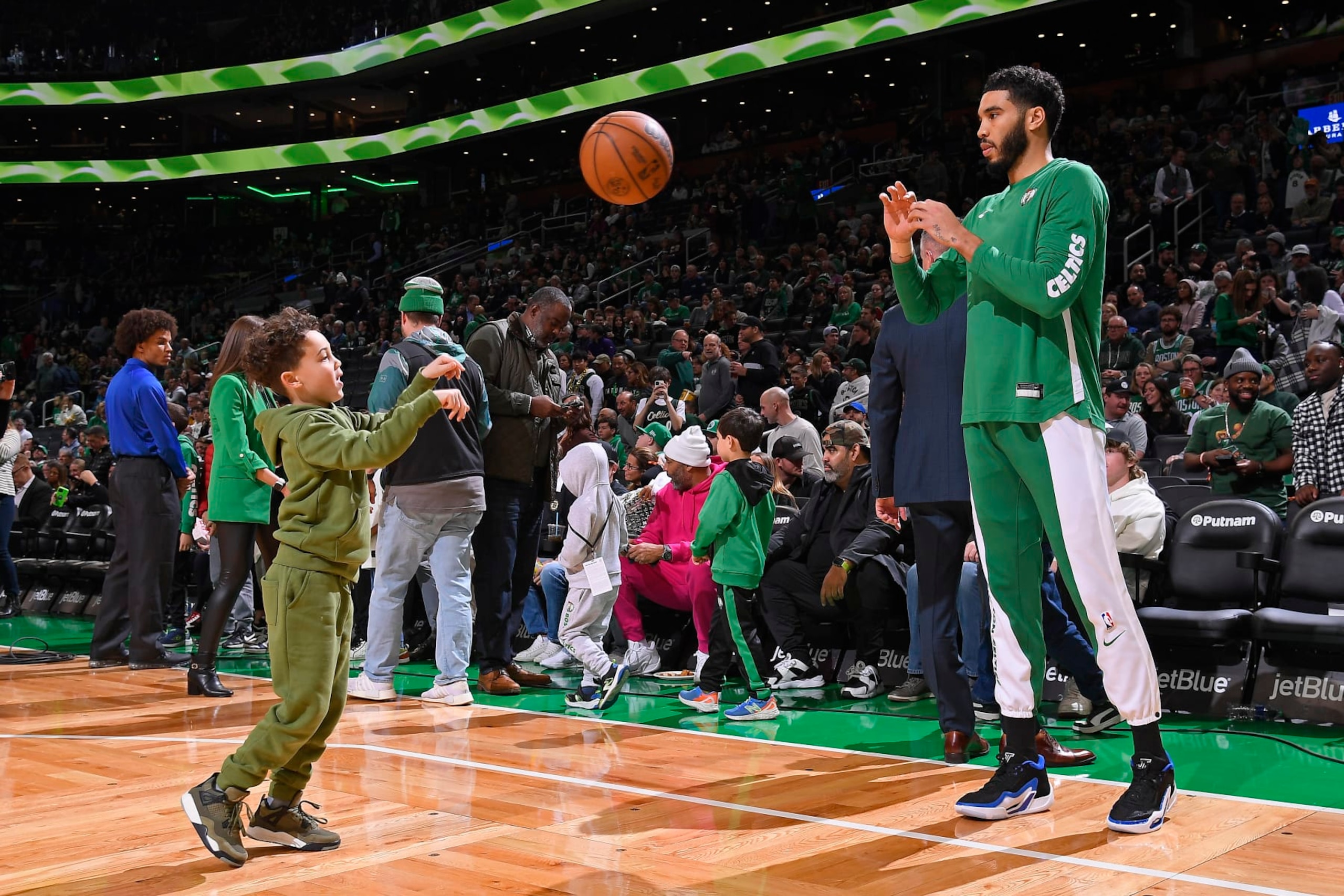 BOSTON, MA - DECEMBER 15: Jayson Tatum #0 of the Boston Celtics and son Deuce Tatum look on before the game against the Orlando Magic on December 15, 2023 at the TD Garden in Boston, Massachusetts. NOTE TO USER: User expressly acknowledges and agrees that, by downloading and or using this photograph, User is consenting to the terms and conditions of the Getty Images License Agreement. Mandatory Copyright Notice: Copyright 2023 NBAE  (Photo by Brian Babineau/NBAE via Getty Images)
