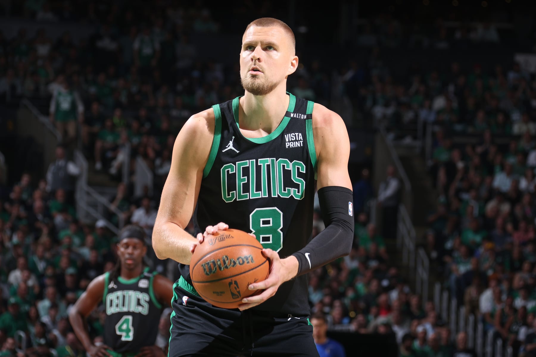 BOSTON, MA - JUNE 9: Kristaps Porzingis #8 of the Boston Celtics shoots a free throw during the game against the Dallas Mavericks during Game 1 of the 2024 NBA Finals on June 9, 2024 at the TD Garden in Boston, Massachusetts. NOTE TO USER: User expressly acknowledges and agrees that, by downloading and or using this photograph, User is consenting to the terms and conditions of the Getty Images License Agreement. Mandatory Copyright Notice: Copyright 2024 NBAE  (Photo by Nathaniel S. Butler/NBAE via Getty Images)