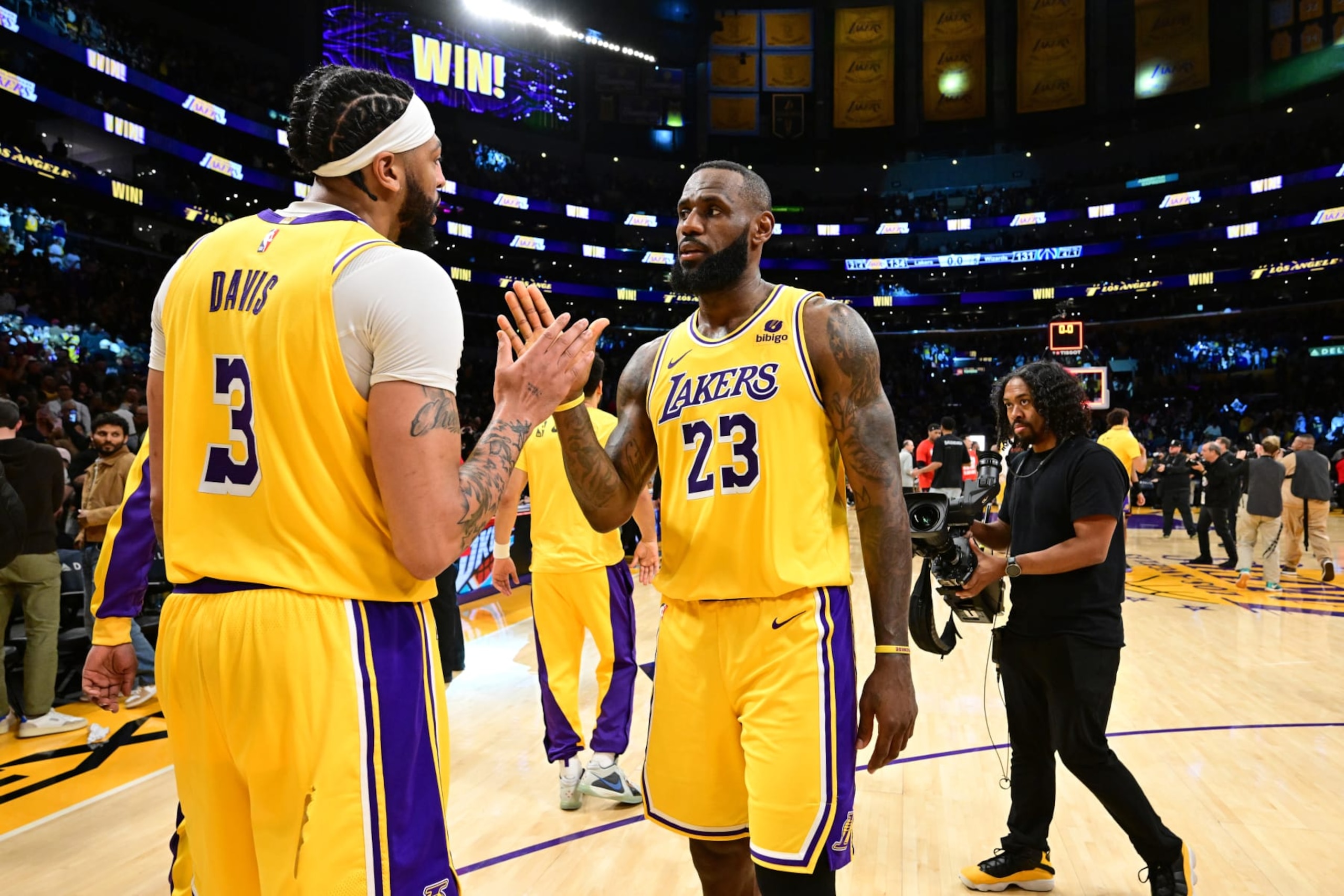 LOS ANGELES, CA - FEBRUARY 29: Anthony Davis #3 and LeBron James #23 of the Los Angeles Lakers high five after the game against the Washington Wizards on February 29, 2024 at Crypto.Com Arena in Los Angeles, California. NOTE TO USER: User expressly acknowledges and agrees that, by downloading and/or using this Photograph, user is consenting to the terms and conditions of the Getty Images License Agreement. Mandatory Copyright Notice: Copyright 2024 NBAE (Photo by Adam Pantozzi/NBAE via Getty Images)