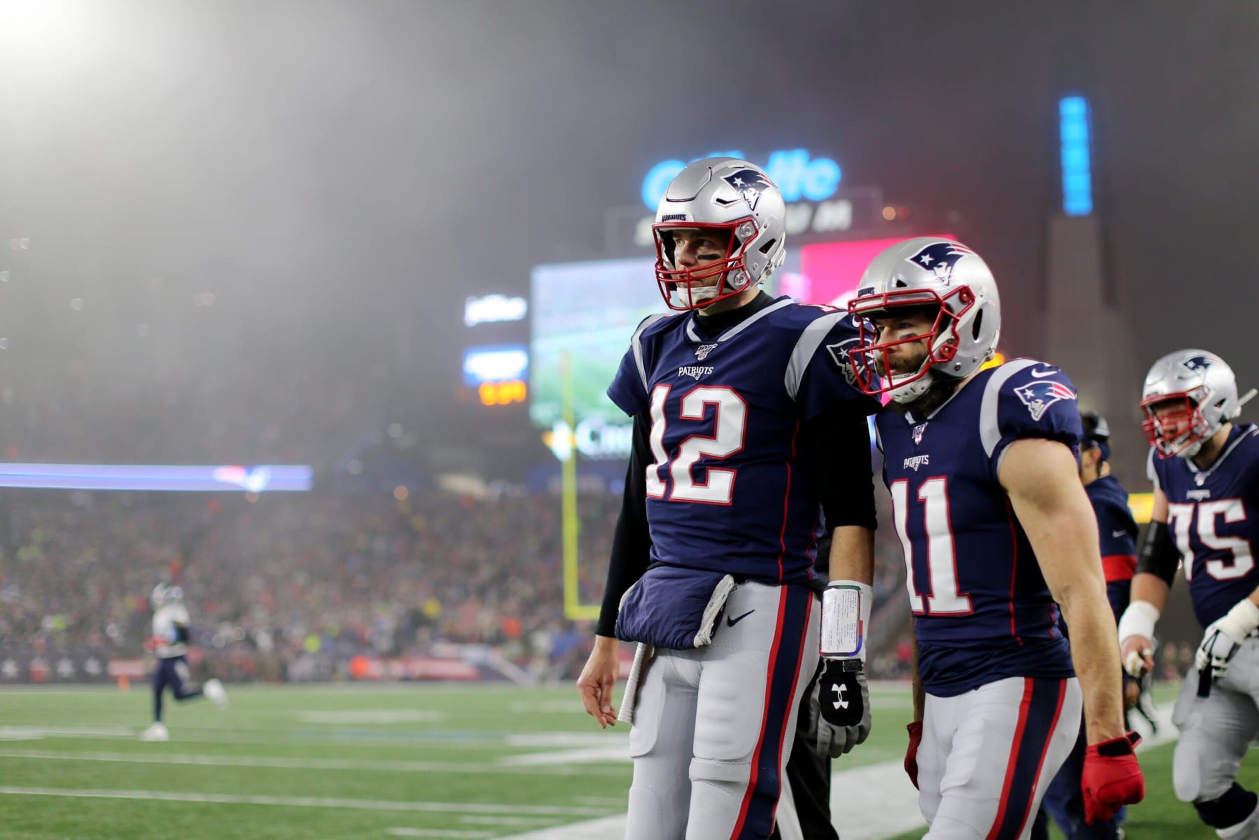 FOXBOROUGH, MASSACHUSETTS - JANUARY 04: Tom Brady #12 of the New England Patriots and Julian Edelman #11 together on the sideline during the the AFC Wild Card Playoff game against the Tennessee Titans at Gillette Stadium on January 04, 2020 in Foxborough, Massachusetts. (Photo by Maddie Meyer/Getty Images) FOXBOROUGH, MASSACHUSETTS - JANUARY 04: Tom Brady #12 of the New England Patriots and Julian Edelman #11 together on the sideline during the the AFC Wild Card Playoff game against the Tennessee Titans at Gillette Stadium on January 04, 2020 in Foxborough, Massachusetts. (Photo by Maddie Meyer/Getty Images)
