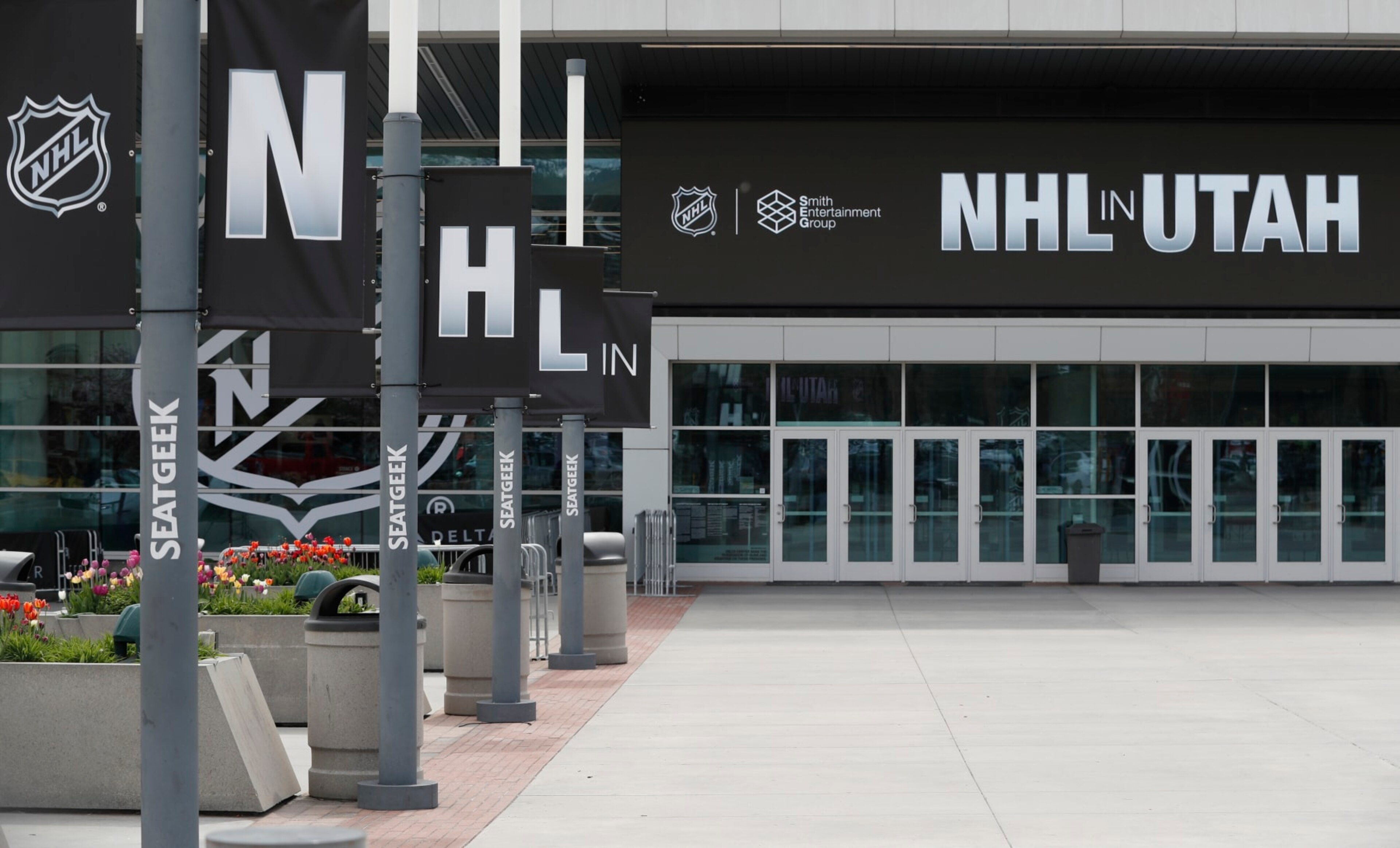 SALT LAKE CITY, UT - APRIL 19: Banners line the main entrance of the Delta Center is seen with the "NHL in Utah" logos on April 19, 2024 in Salt Lake City, Utah. The NHL has allowed the sale of the Arizona Coyotes and the team will relocate to Salt Lake City, Utah. (Photo by Chris Gardner/Getty Images) SALT LAKE CITY, UT - APRIL 19: Banners line the main entrance of the Delta Center is seen with the "NHL in Utah" logos on April 19, 2024 in Salt Lake City, Utah. The NHL has allowed the sale of the Arizona Coyotes and the team will relocate to Salt Lake City, Utah. (Photo by Chris Gardner/Getty Images)