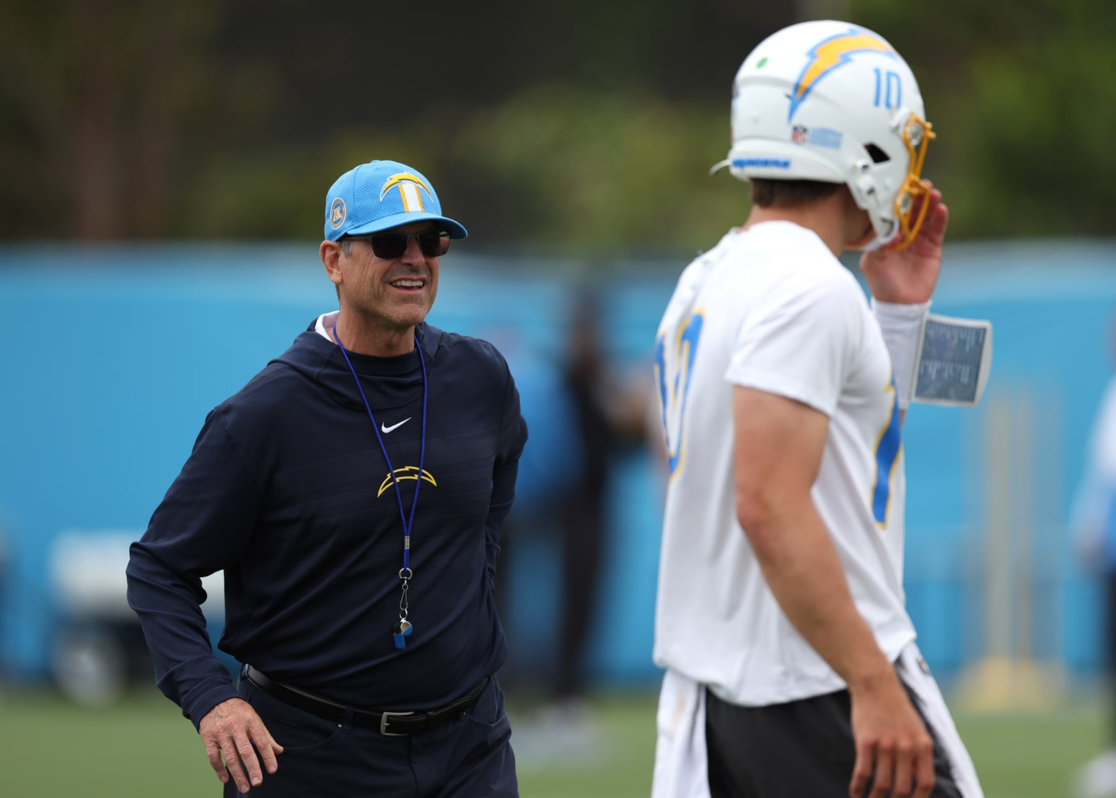 COSTA MESA, CALIFORNIA - MAY 20: Head coach Jim Harbaugh and quarterback Justin Herbert during a Los Angeles Chargers OTA offseason workout on May 20, 2024 in Costa Mesa, California. (Photo by Harry How/Getty Images) COSTA MESA, CALIFORNIA - MAY 20: Head coach Jim Harbaugh and quarterback Justin Herbert during a Los Angeles Chargers OTA offseason workout on May 20, 2024 in Costa Mesa, California. (Photo by Harry How/Getty Images)