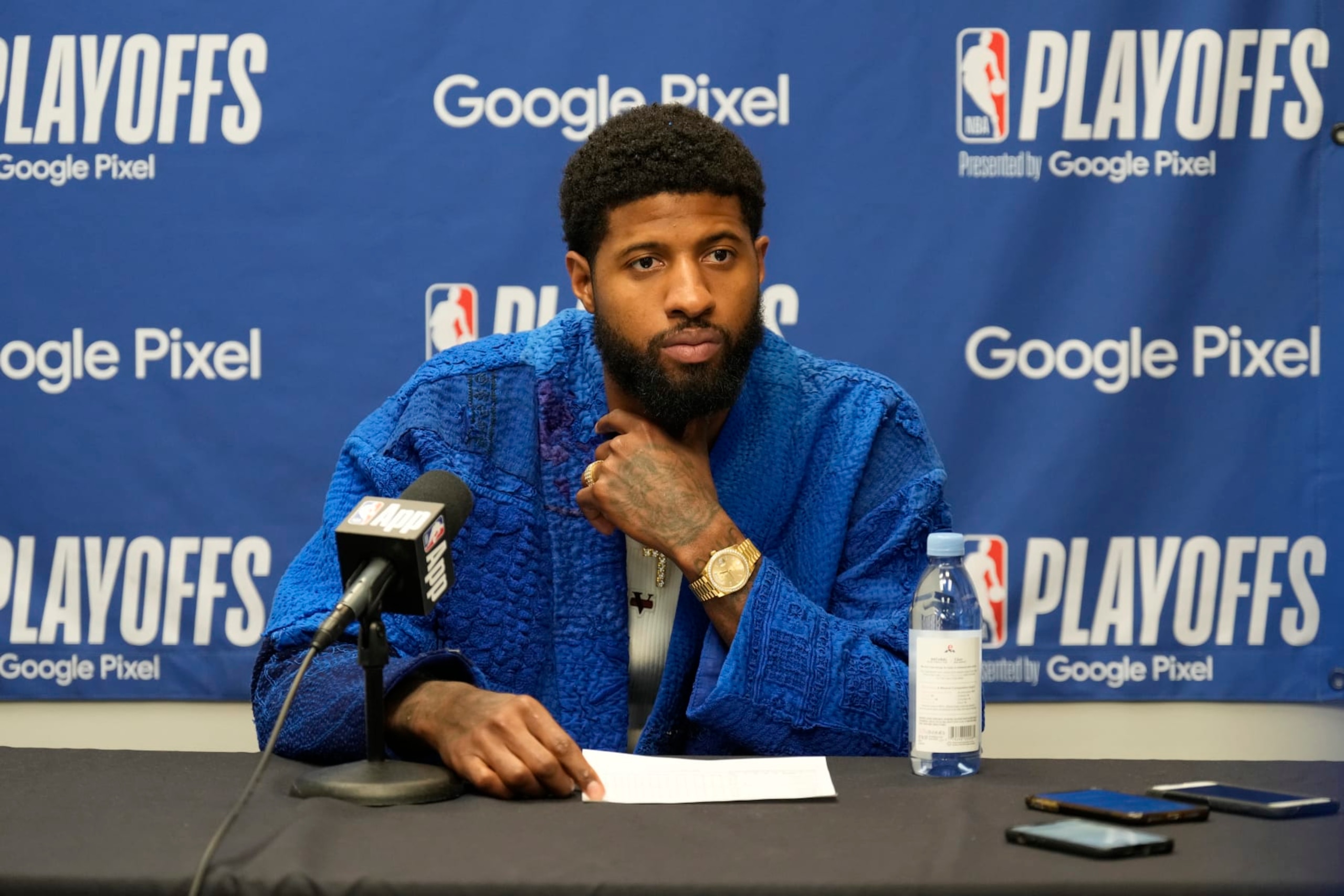 DALLAS, TX - MAY 3:  Paul George #13 of the LA Clippers is interviewed by the media after Round 1 Game 6 of the 2024 NBA Playoffs against the Dallas Mavericks on May 3, 2024 at the American Airlines Center in Dallas, Texas. NOTE TO USER: User expressly acknowledges and agrees that, by downloading and or using this photograph, User is consenting to the terms and conditions of the Getty Images License Agreement. Mandatory Copyright Notice: Copyright 2024 NBAE (Photo by Jim Cowsert/NBAE via Getty Images)