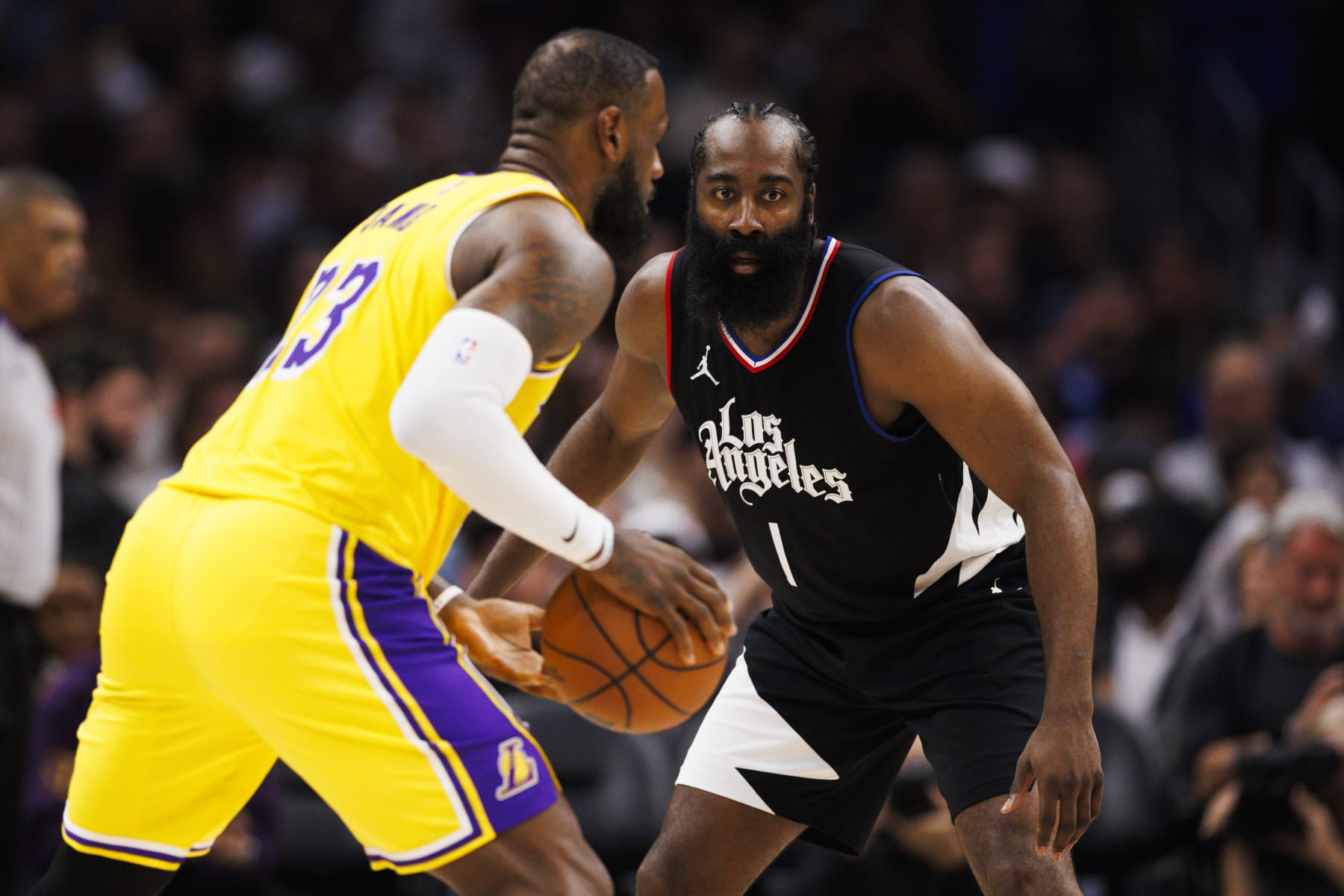 LOS ANGELES, CA - FEBRUARY 28: LA Clippers guard James Harden (1) defends against Los Angeles Lakers forward LeBron James (23) during an NBA basketball game on February 28, 2024 at Crypto.com Arena in Los Angeles, CA. (Photo by Ric Tapia/Icon Sportswire via Getty Images)