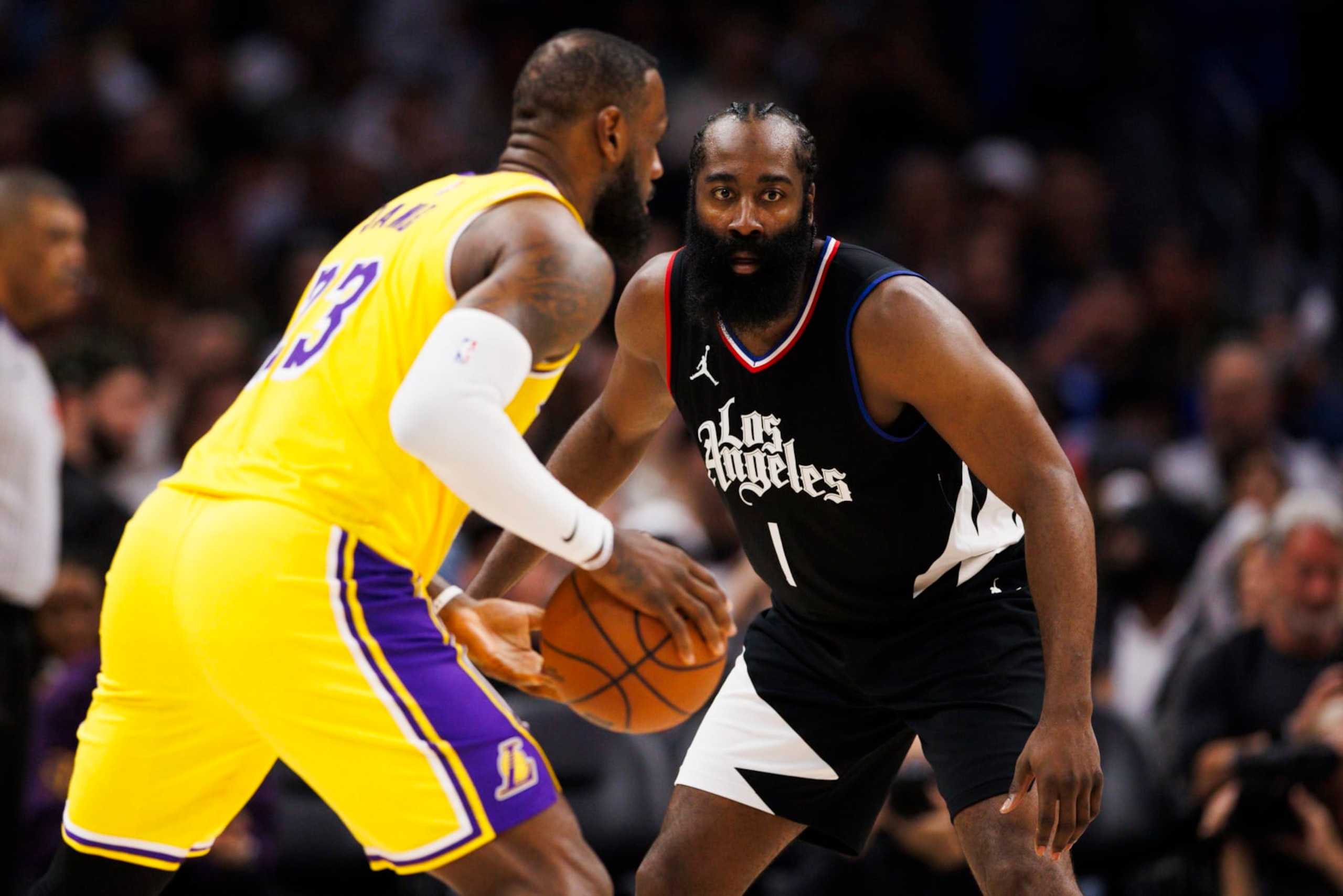 LOS ANGELES, CA - FEBRUARY 28: LA Clippers guard James Harden (1) defends against Los Angeles Lakers forward LeBron James (23) during an NBA basketball game on February 28, 2024 at Crypto.com Arena in Los Angeles, CA. (Photo by Ric Tapia/Icon Sportswire via Getty Images)