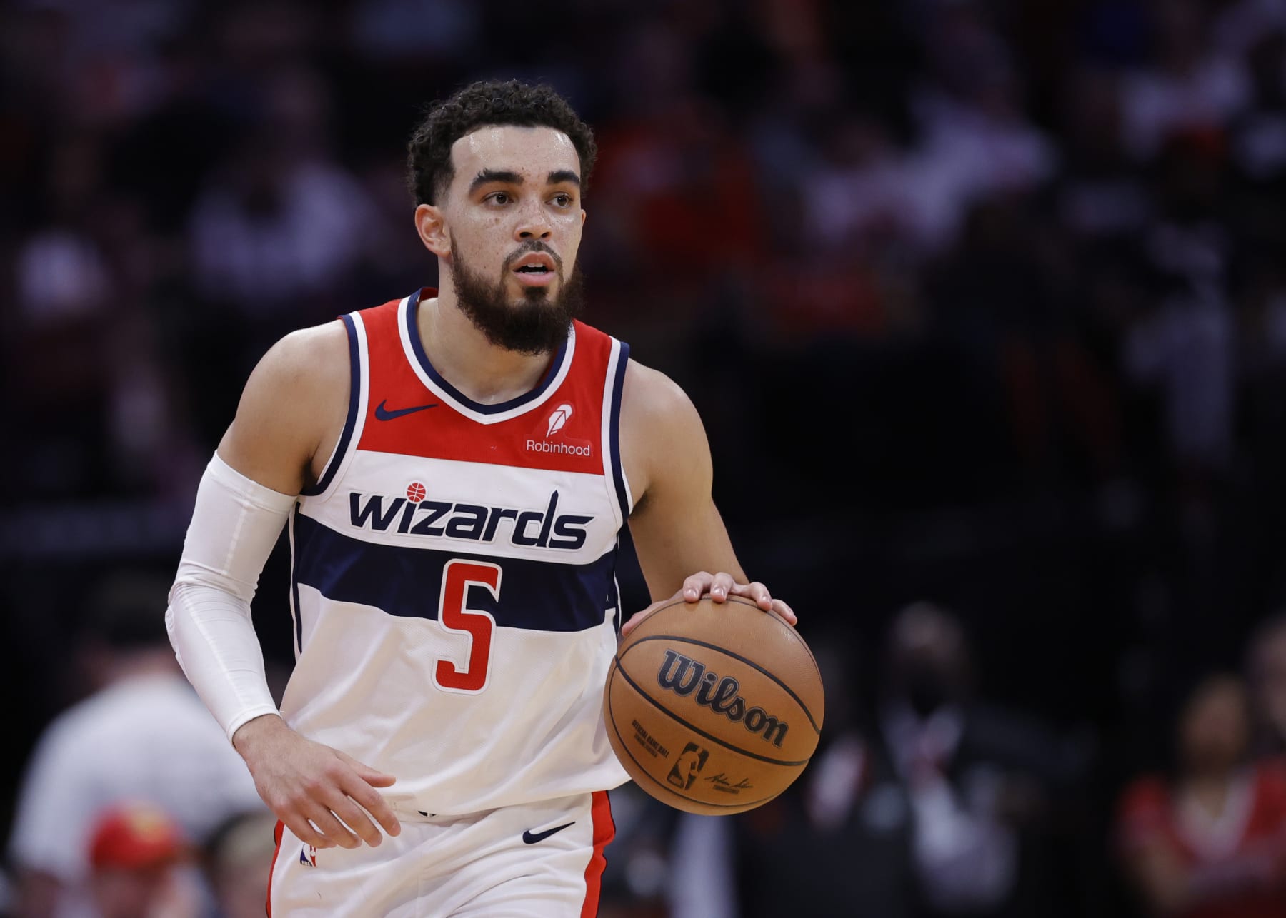 HOUSTON, TEXAS - MARCH 14: Tyus Jones #5 of the Washington Wizards in action against the Houston Rockets during the first half at Toyota Center on March 14, 2024 in Houston, Texas. NOTE TO USER: User expressly acknowledges and agrees that, by downloading and or using this photograph, User is consenting to the terms and conditions of the Getty Images License Agreement.  (Photo by Carmen Mandato/Getty Images)