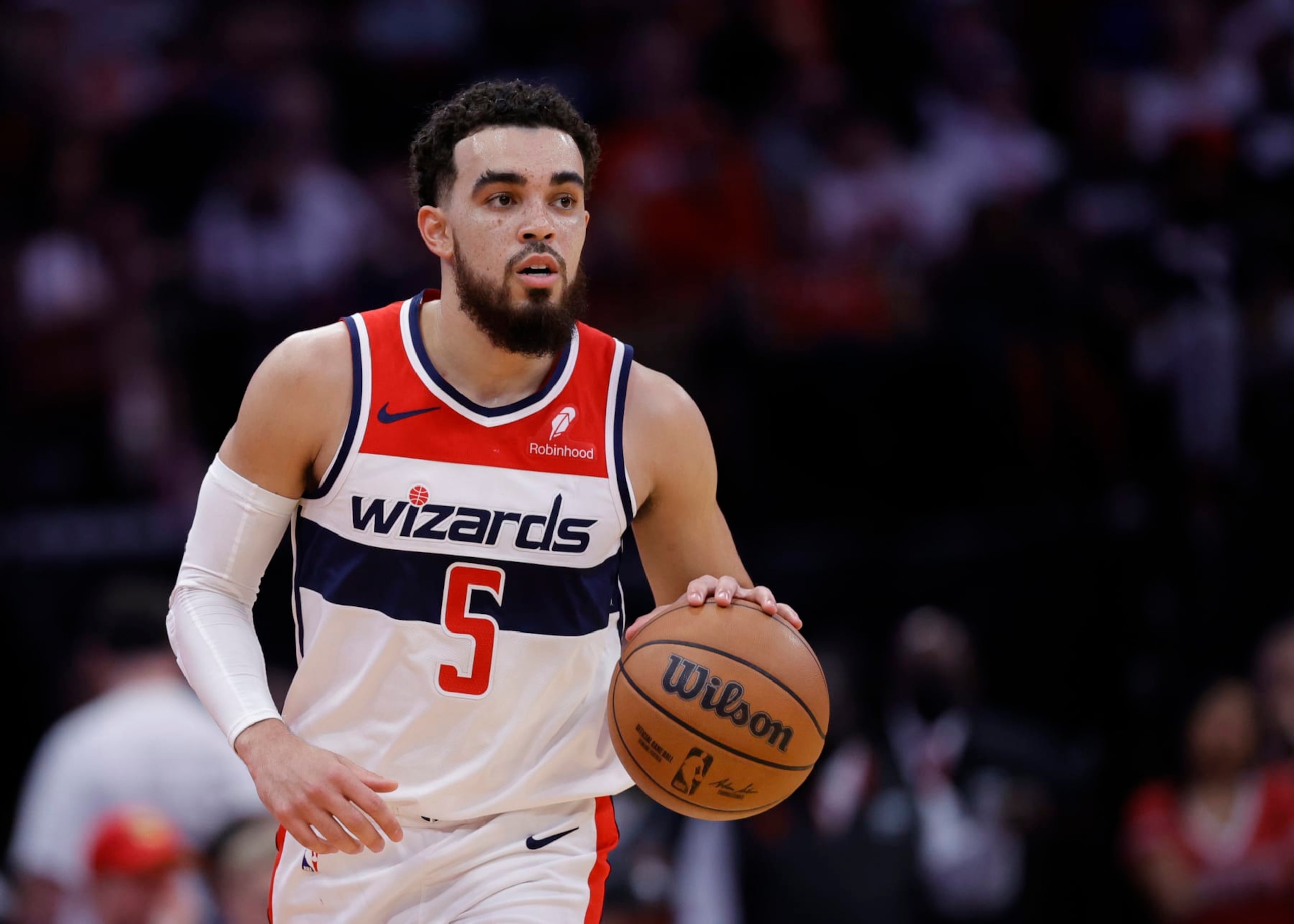 HOUSTON, TEXAS - MARCH 14: Tyus Jones #5 of the Washington Wizards in action against the Houston Rockets during the first half at Toyota Center on March 14, 2024 in Houston, Texas. NOTE TO USER: User expressly acknowledges and agrees that, by downloading and or using this photograph, User is consenting to the terms and conditions of the Getty Images License Agreement.  (Photo by Carmen Mandato/Getty Images)