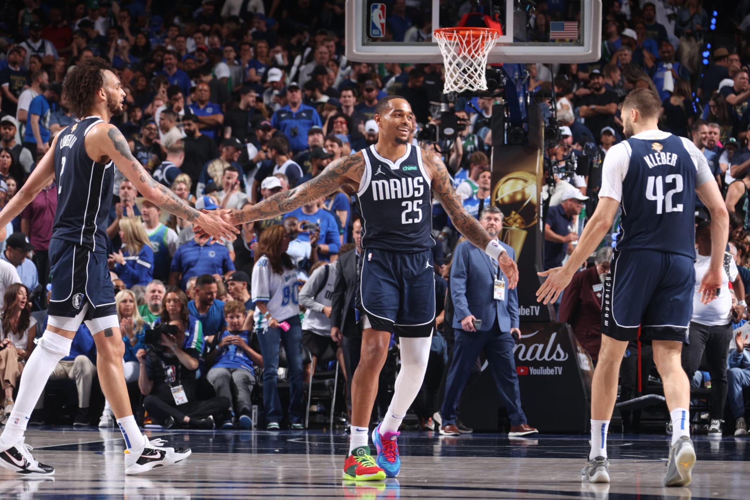 DALLAS, TX - JUNE 12: PJ Washington #25 high fives Dereck Lively II #2  and Maxi Kleber #42 of the Dallas Mavericks during the game against the Boston Celtics during Game 3 of the 2024 NBA Finals on June 12, 2024 at the American Airlines Center in Dallas, Texas. NOTE TO USER: User expressly acknowledges and agrees that, by downloading and or using this photograph, User is consenting to the terms and conditions of the Getty Images License Agreement. Mandatory Copyright Notice: Copyright 2024 NBAE (Photo by Nathaniel S. Butler/NBAE via Getty Images)