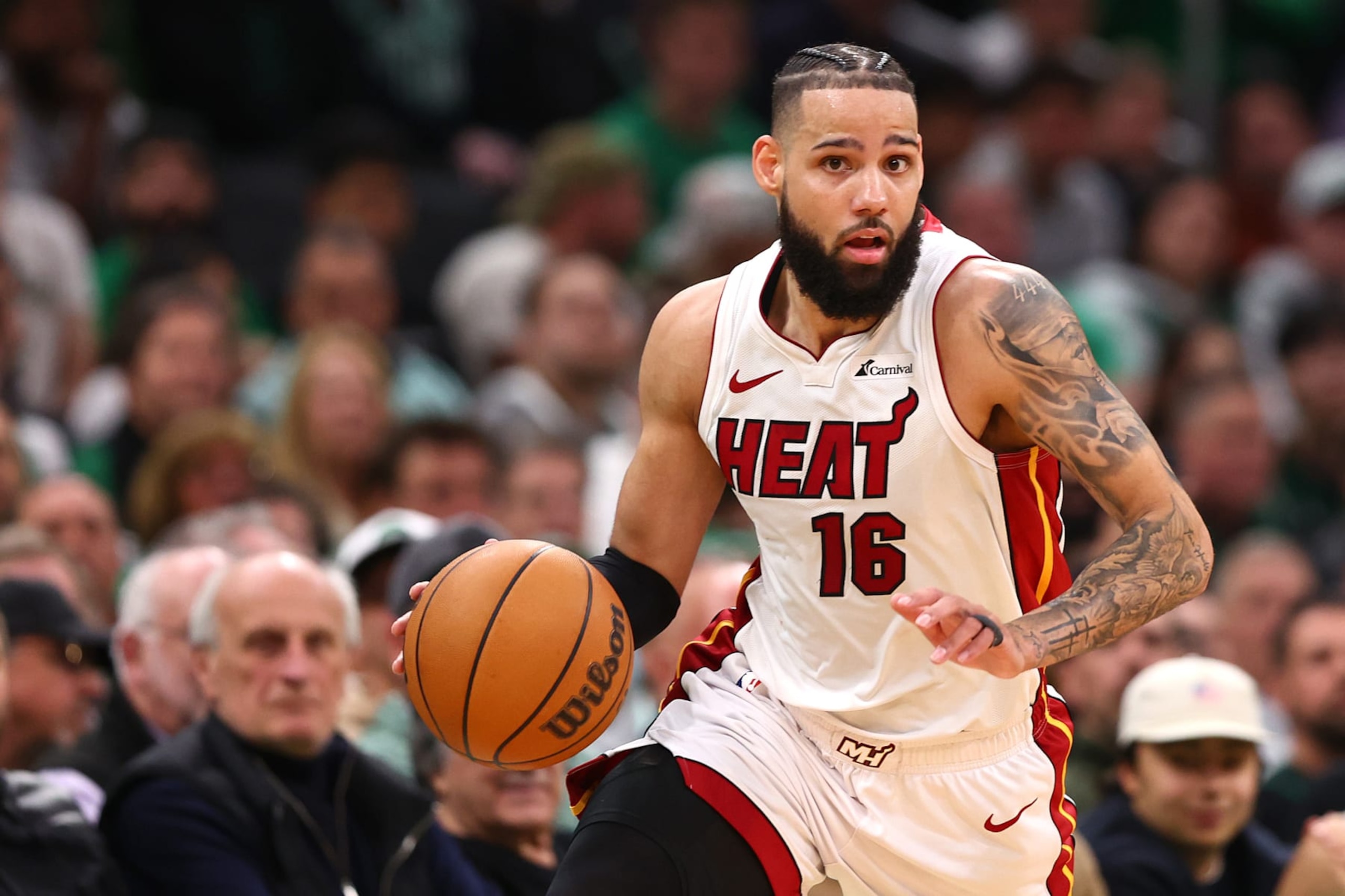 BOSTON, MASSACHUSETTS - MAY 01: Caleb Martin #16 of the Miami Heat dribbles against the Boston Celtics during the second quarter of game five of the Eastern Conference First Round Playoffs at TD Garden on May 01, 2024 in Boston, Massachusetts. NOTE TO USER: User expressly acknowledges and agrees that, by downloading and/or using this Photograph, user is consenting to the terms and conditions of the Getty Images License Agreement.  (Photo by Maddie Meyer/Getty Images)