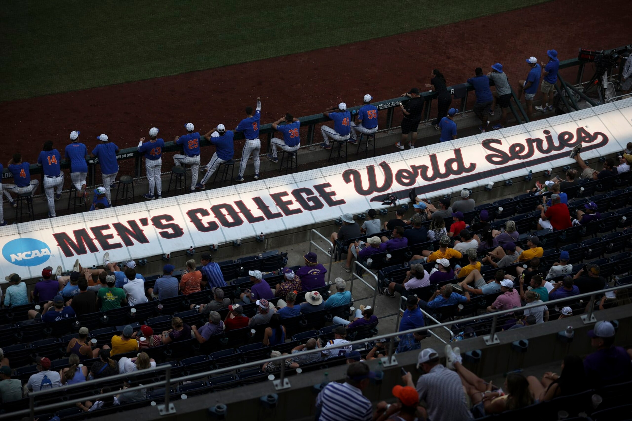 OMAHA, NE - JUNE 25: The Mens College World Series logo is illuminated but the setting sun during Game 2 of the Division I Mens Baseball Championship finals between the LSU Tigers and the Florida Gators held at Charles Schwab Field on June 25, 2023 in Omaha, Nebraska. (Photo by Tyler Schank/NCAA Photos via Getty Images) OMAHA, NE - JUNE 25: The Mens College World Series logo is illuminated but the setting sun during Game 2 of the Division I Mens Baseball Championship finals between the LSU Tigers and the Florida Gators held at Charles Schwab Field on June 25, 2023 in Omaha, Nebraska. (Photo by Tyler Schank/NCAA Photos via Getty Images)