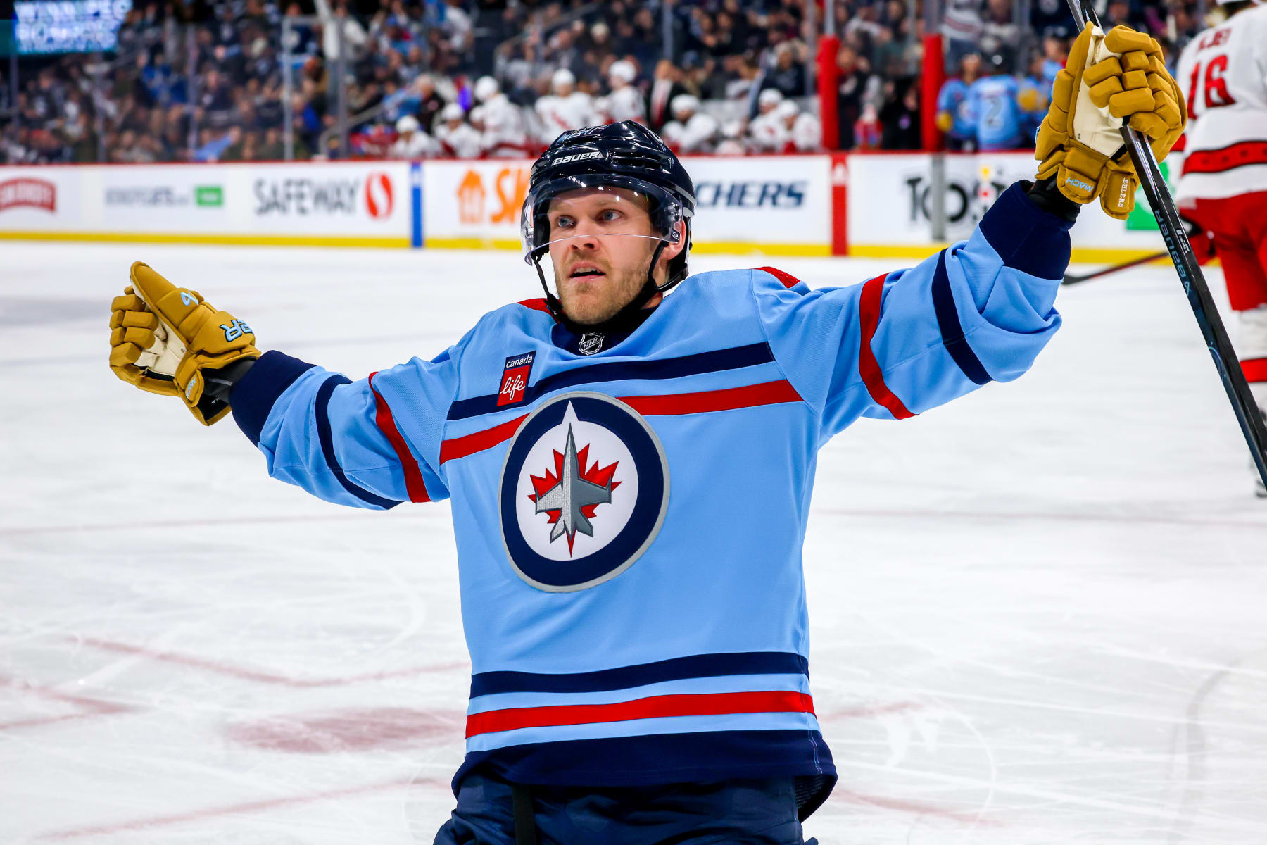 WINNIPEG, CANADA - DECEMBER 04: Nikolaj Ehlers #27 of the Winnipeg Jets celebrates his second period goal against the Carolina Hurricanes at Canada Life Centre on December 04, 2023 in Winnipeg, Manitoba, Canada. (Photo by Jonathan Kozub/NHLI via Getty Images)