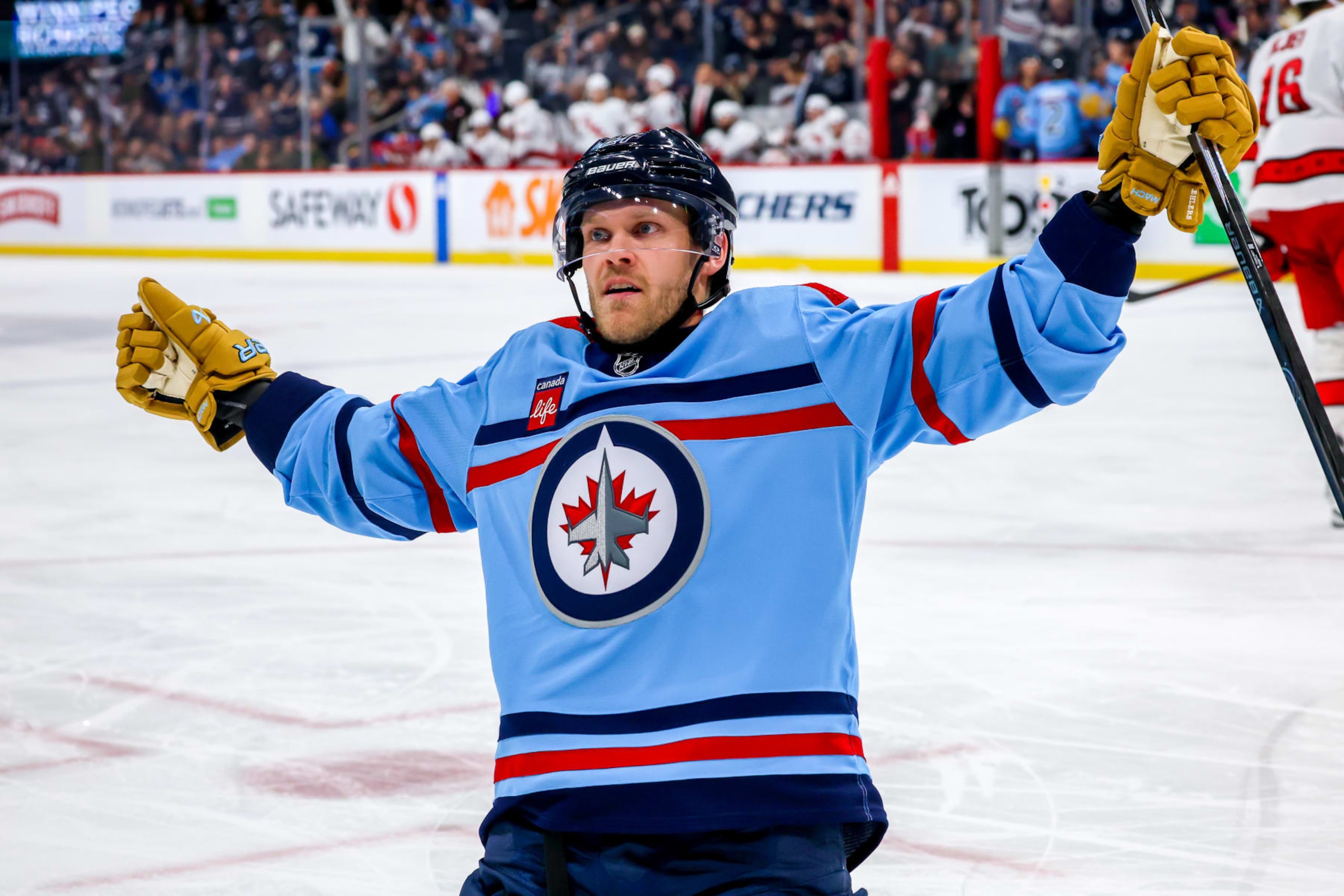 WINNIPEG, CANADA - DECEMBER 04: Nikolaj Ehlers #27 of the Winnipeg Jets celebrates his second period goal against the Carolina Hurricanes at Canada Life Centre on December 04, 2023 in Winnipeg, Manitoba, Canada. (Photo by Jonathan Kozub/NHLI via Getty Images)