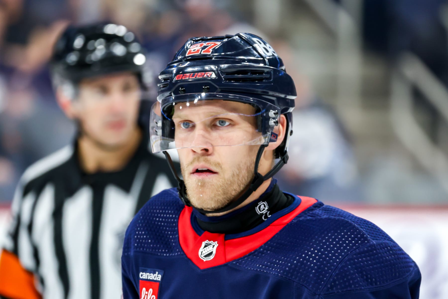 WINNIPEG, CANADA - NOVEMBER 18: Nikolaj Ehlers #27 of the Winnipeg Jets looks on during a third period stoppage in play against the Arizona Coyotes at the Canada Life Centre on November 18, 2023 in Winnipeg, Manitoba, Canada. (Photo by Jonathan Kozub/NHLI via Getty Images)