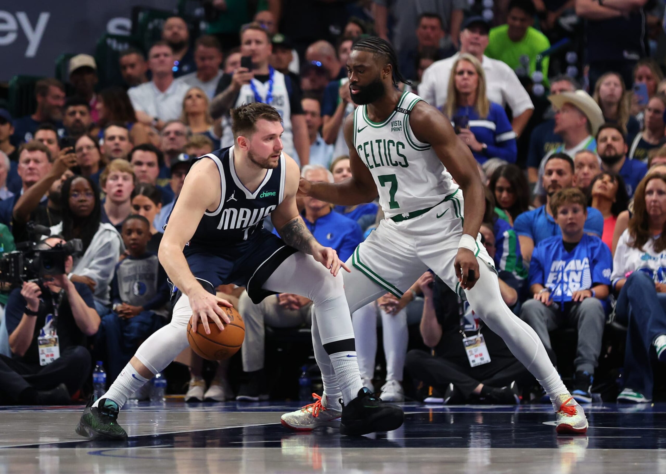 DALLAS, TEXAS - JUNE 12: Luka DonÄiÄ #77 of the Dallas Mavericks dribbles the ball while being guarded by Jaylen Brown #7 of the Boston Celtics in the fourth quarter in Game Three of the 2024 NBA Finals at American Airlines Center on June 12, 2024 in Dallas, Texas. NOTE TO USER: User expressly acknowledges and agrees that, by downloading and or using this photograph, User is consenting to the terms and conditions of the Getty Images License Agreement. (Photo by Stacy Revere/Getty Images) DALLAS, TEXAS - JUNE 12: Luka DonÄiÄ #77 of the Dallas Mavericks dribbles the ball while being guarded by Jaylen Brown #7 of the Boston Celtics in the fourth quarter in Game Three of the 2024 NBA Finals at American Airlines Center on June 12, 2024 in Dallas, Texas. NOTE TO USER: User expressly acknowledges and agrees that, by downloading and or using this photograph, User is consenting to the terms and conditions of the Getty Images License Agreement. (Photo by Stacy Revere/Getty Images)