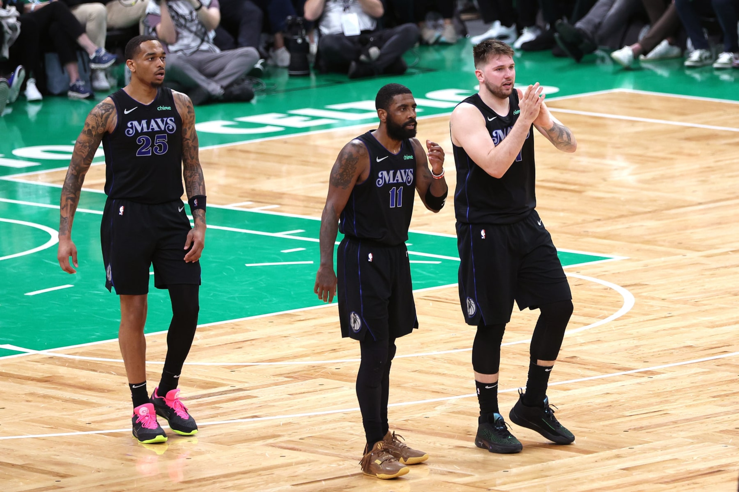 BOSTON, MASSACHUSETTS - JUNE 06: Luka Doncic #77 and Kyrie Irving #11 of the Dallas Mavericks react during the third quarter against the Boston Celtics in Game One of the 2024 NBA Finals at TD Garden on June 06, 2024 in Boston, Massachusetts. NOTE TO USER: User expressly acknowledges and agrees that, by downloading and or using this photograph, User is consenting to the terms and conditions of the Getty Images License Agreement. (Photo by Adam Glanzman/Getty Images) BOSTON, MASSACHUSETTS - JUNE 06: Luka Doncic #77 and Kyrie Irving #11 of the Dallas Mavericks react during the third quarter against the Boston Celtics in Game One of the 2024 NBA Finals at TD Garden on June 06, 2024 in Boston, Massachusetts. NOTE TO USER: User expressly acknowledges and agrees that, by downloading and or using this photograph, User is consenting to the terms and conditions of the Getty Images License Agreement. (Photo by Adam Glanzman/Getty Images)