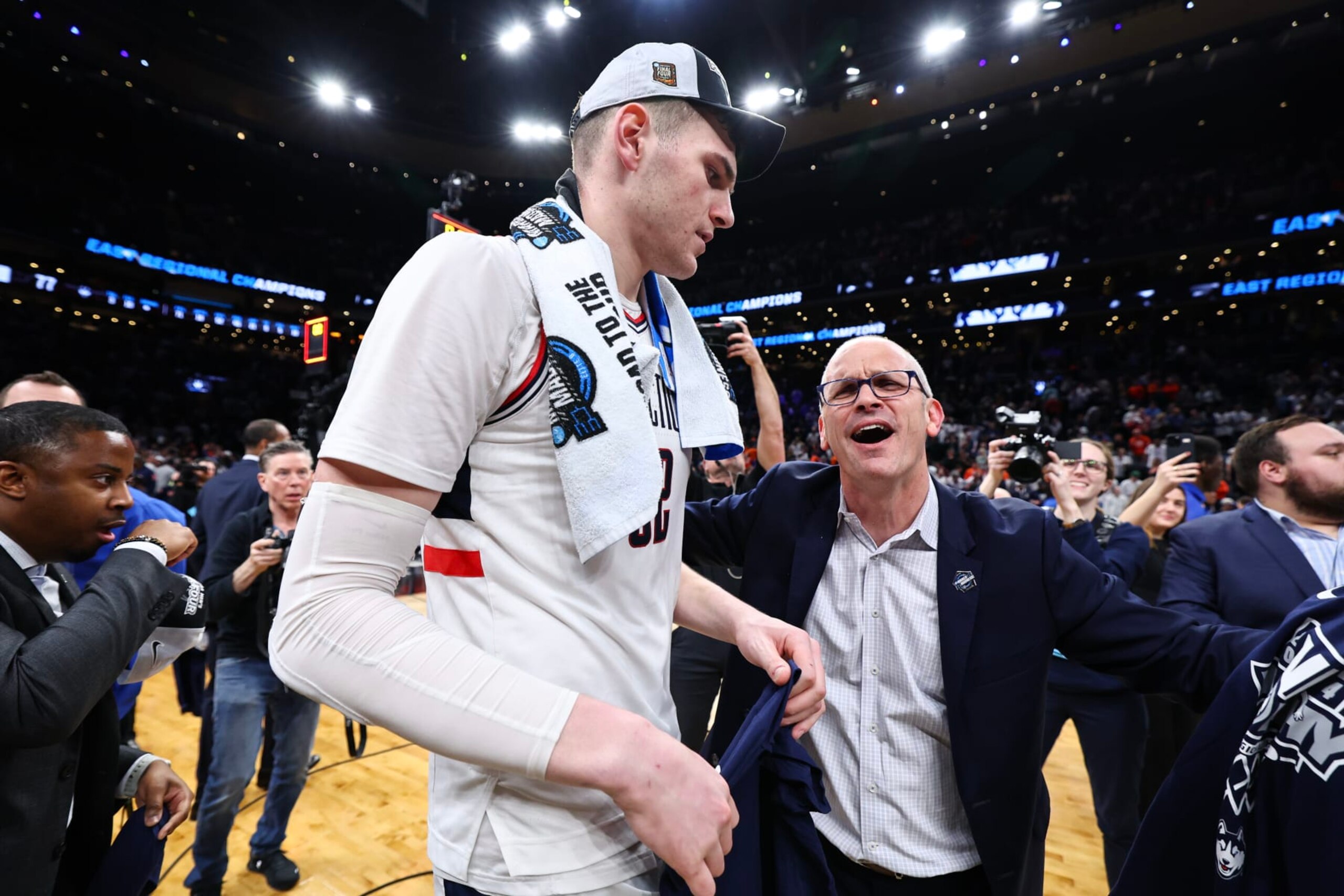 BOSTON, MASSACHUSETTS - MARCH 30: Donovan Clingan #32 of the Connecticut Huskies and Dan Hurley Head coach of the Connecticut Huskies celebrate a win against the Illinois Fighting Illini Elite Eight round of the 2024 NCAA Men's Basketball Tournament held at TD Garden on March 30, 2024 in Boston, Massachusetts. (Photo by Jamie Schwaberow/NCAA Photos via Getty Images)