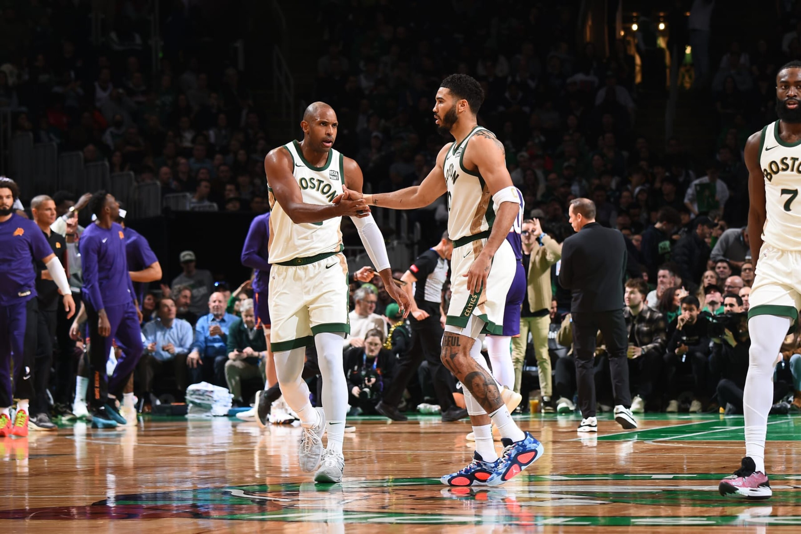 BOSTON, MA - MARCH 14: Jayson Tatum #0 and Al Horford #42 of the Boston Celtics high five during the game against the Phoenix Suns on March 14, 2024 at the TD Garden in Boston, Massachusetts. NOTE TO USER: User expressly acknowledges and agrees that, by downloading and or using this photograph, User is consenting to the terms and conditions of the Getty Images License Agreement. Mandatory Copyright Notice: Copyright 2024 NBAE  (Photo by Brian Babineau/NBAE via Getty Images)