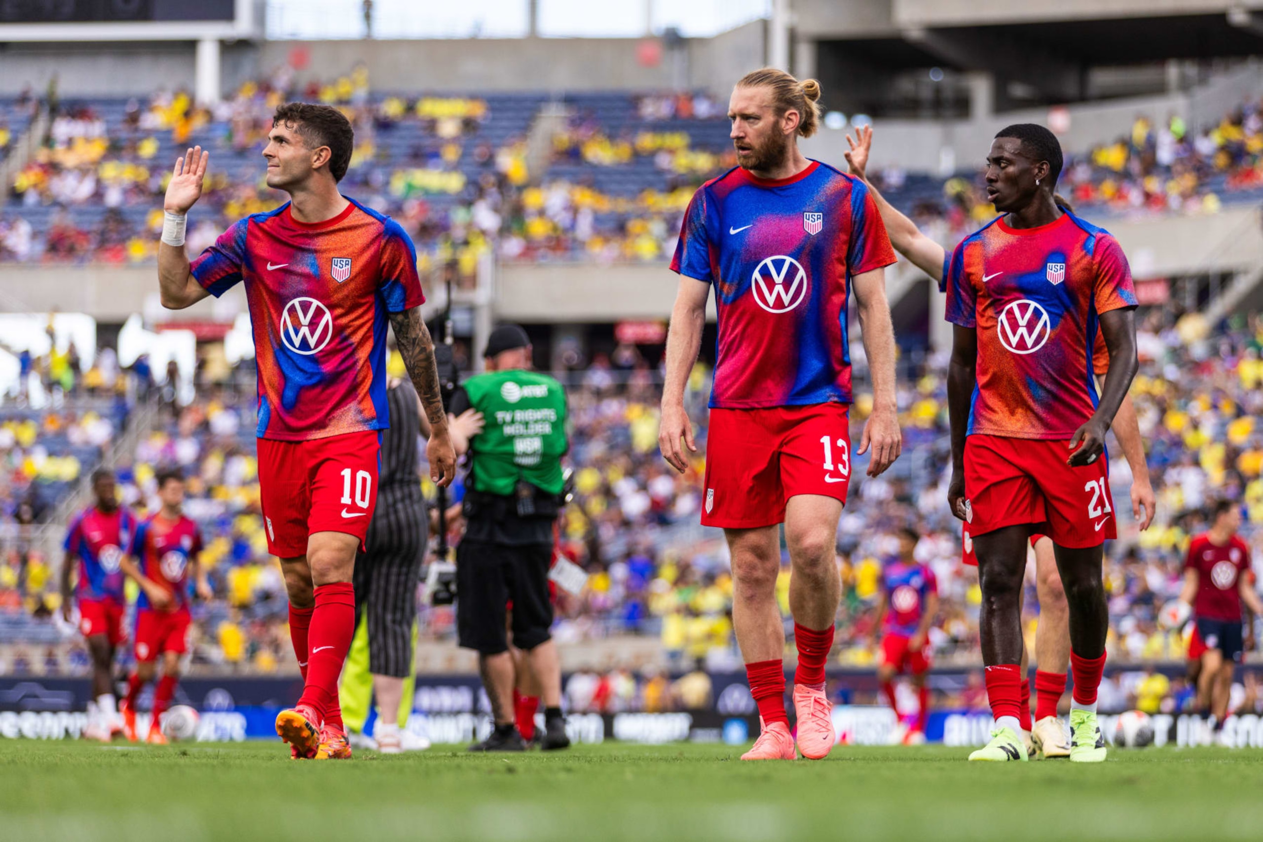 ORLANDO, FLORIDA - JUNE 12: Christian Pulisic #10, Tim Ream #13, and Tim Weah #21 of the United States at Camping World Stadium on June 12, 2024 in Orlando, Florida. (Photo by Mark Thorstenson/ISI Photos/USSF/Getty Images for USSF)