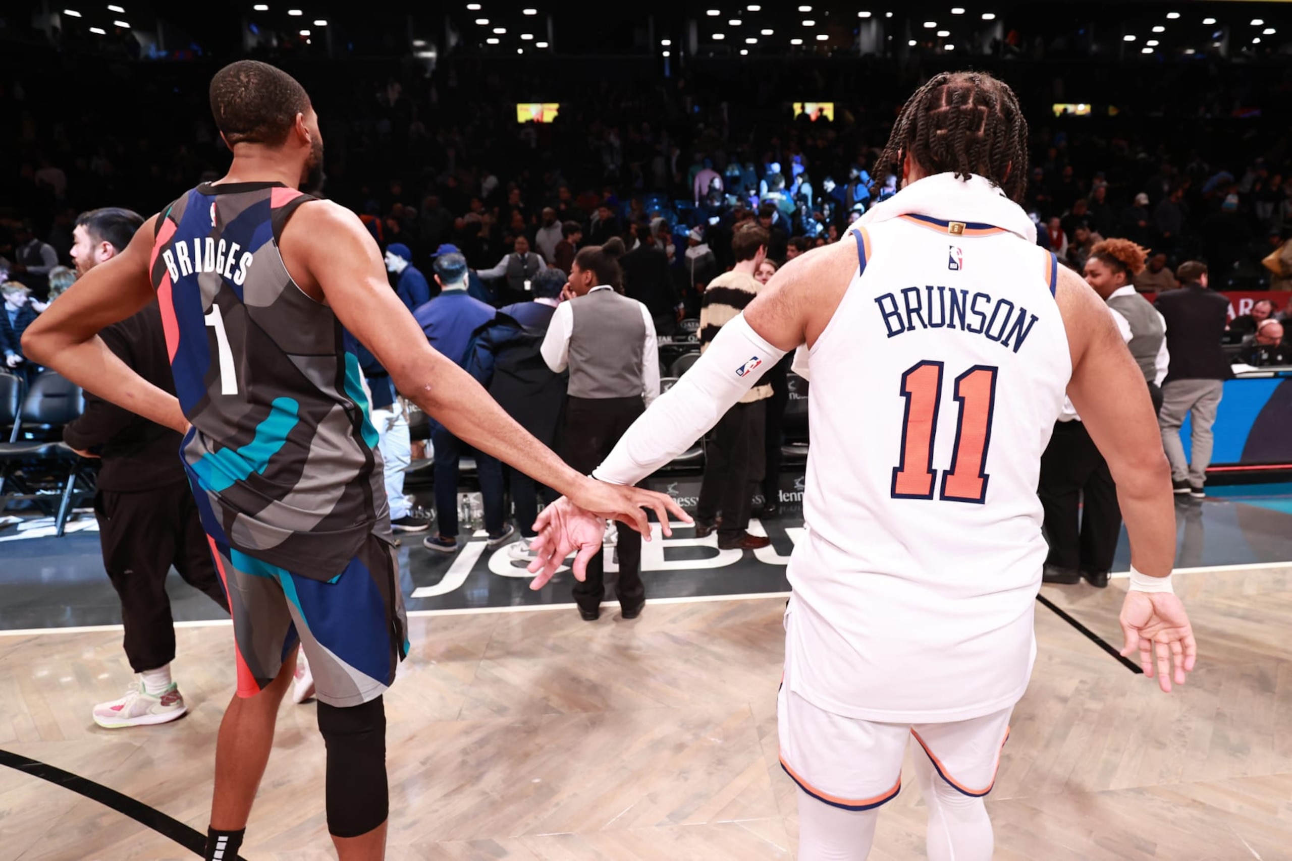 BROOKLYN, NY - DECEMBER 20: Mikal Bridges #1 of the Brooklyn Nets high fives Jalen Brunson #11 of the New York Knicks after the game on December 20, 2023 at Barclays Center in Brooklyn, New York. NOTE TO USER: User expressly acknowledges and agrees that, by downloading and or using this Photograph, user is consenting to the terms and conditions of the Getty Images License Agreement. Mandatory Copyright Notice: Copyright 2023 NBAE (Photo by Nathaniel S. Butler/NBAE via Getty Images)