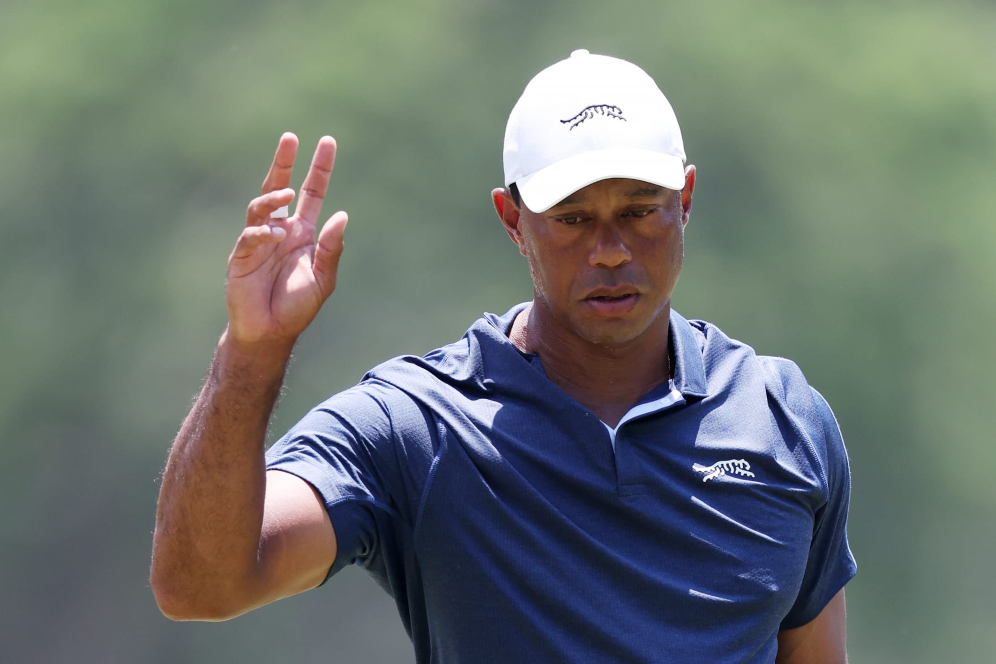 PINEHURST, NORTH CAROLINA - JUNE 14: Tiger Woods of the United States reacts after putting on the second green during the second round of the 124th U.S. Open at Pinehurst Resort on June 14, 2024 in Pinehurst, North Carolina. (Photo by Sean M. Haffey/Getty Images) PINEHURST, NORTH CAROLINA - JUNE 14: Tiger Woods of the United States reacts after putting on the second green during the second round of the 124th U.S. Open at Pinehurst Resort on June 14, 2024 in Pinehurst, North Carolina. (Photo by Sean M. Haffey/Getty Images)