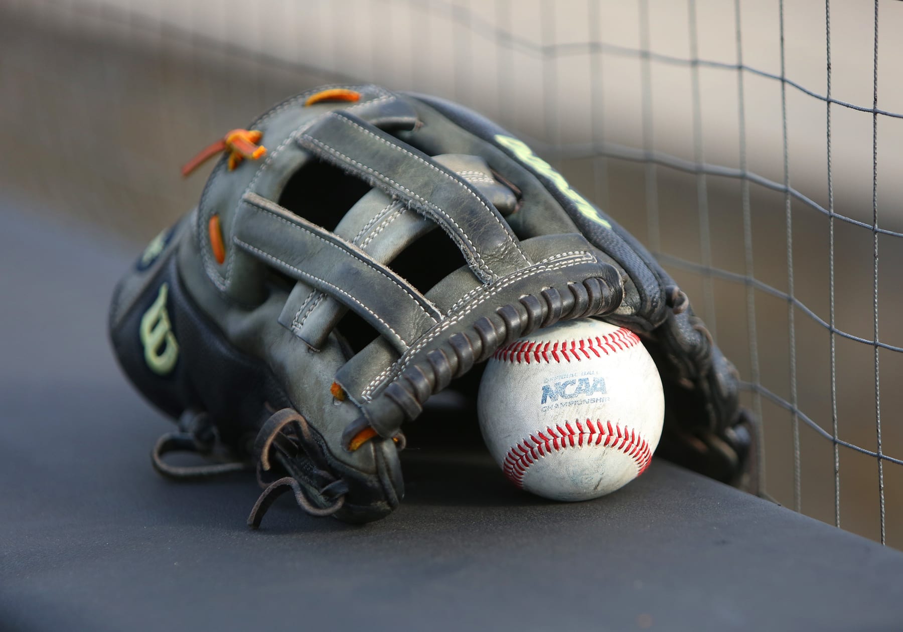 LEXINGTON, KY - JUNE 09: A glove and NCAA baseball rest on a ledge before an NCAA super regional game between the Oregon State Beavers and the Kentucky Wildcats on June 9, 2024, at Kentucky Proud Park in Lexington, KY. (Photo by Jeff Moreland/Icon Sportswire via Getty Images)
