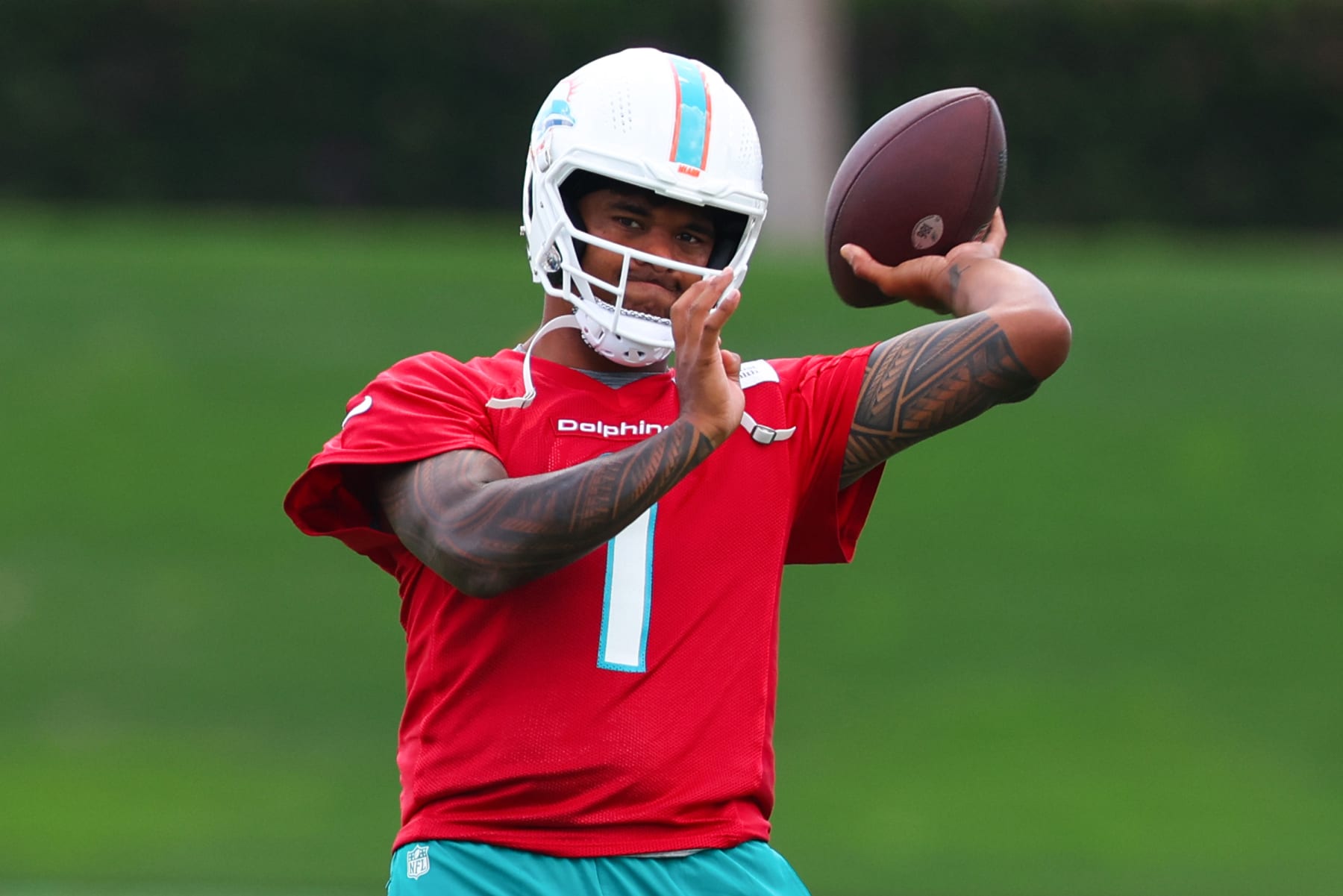 MIAMI GARDENS, FLORIDA - JUNE 04: Tua Tagovailoa #1 of the Miami Dolphins throws a pass during Miami Dolphins Mandatory Minicamp on June 04, 2024 in Miami Gardens, Florida. (Photo by Megan Briggs/Getty Images)