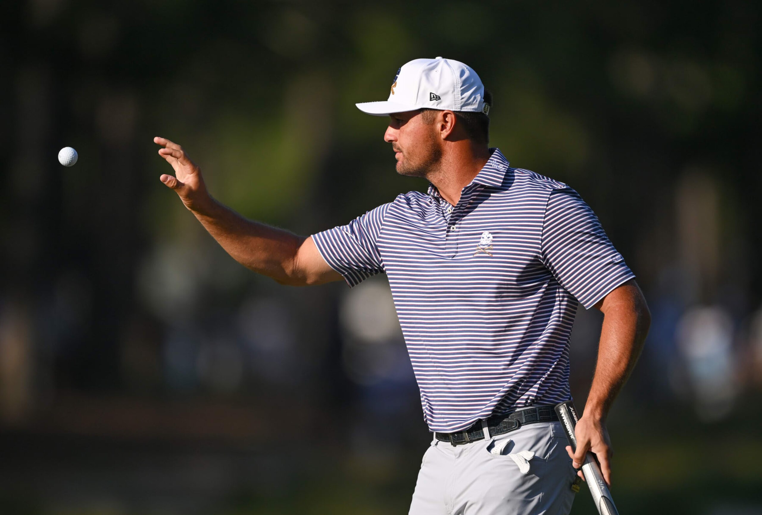 PINEHURST, NORTH CAROLINA - JUNE 14: Bryson DeChambeau of the United States catches his ball on the second green during the second round of the 124th U.S. Open at Pinehurst Resort on June 14, 2024 in Pinehurst, North Carolina. (Photo by Ross Kinnaird/Getty Images)