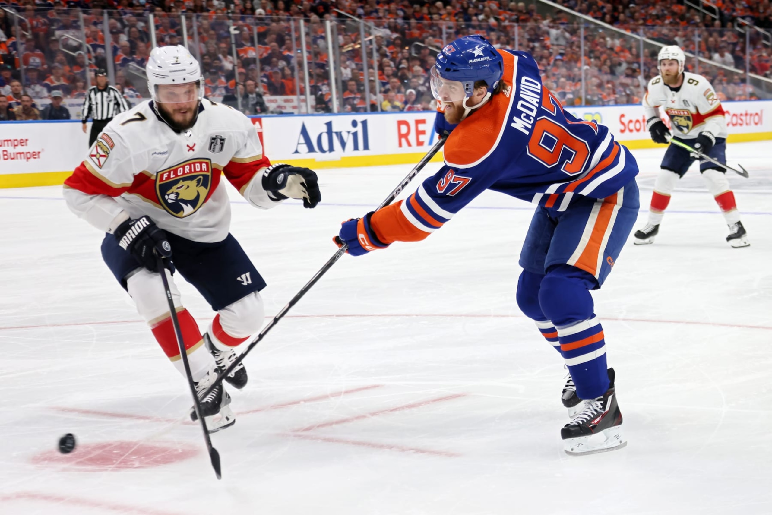 EDMONTON, CANADA - JUNE 13: Connor McDavid #97 of the Edmonton Oilers shoots past Dmitry Kulikov #7 of the Florida Panthers during the first period of Game Three of the 2024 Stanley Cup Final at Rogers Place on June 13, 2024 in Edmonton, Alberta, Canada. (Photo by Bruce Bennett/Getty Images) EDMONTON, CANADA - JUNE 13: Connor McDavid #97 of the Edmonton Oilers shoots past Dmitry Kulikov #7 of the Florida Panthers during the first period of Game Three of the 2024 Stanley Cup Final at Rogers Place on June 13, 2024 in Edmonton, Alberta, Canada. (Photo by Bruce Bennett/Getty Images)
