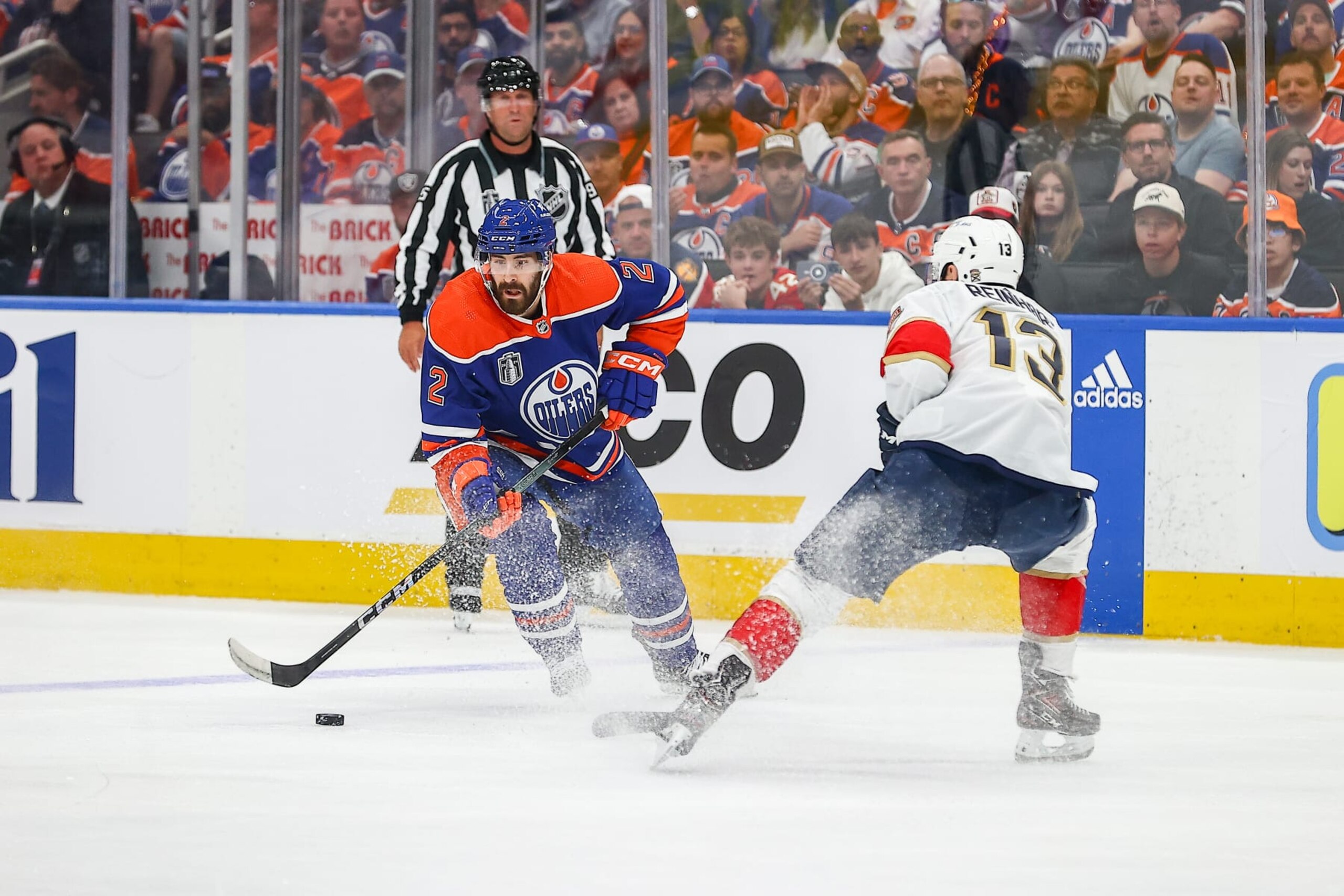 EDMONTON, AB - JUNE 13 : Edmonton Oilers Defenceman Evan Bouchard (2) skates past Florida Panthers Center Sam Reinhart (13) in the second period of game three of the Stanley Cup Final Round Edmonton Oilers game versus the Florida Panthers on June 13, 2024 at Rogers Place in Edmonton, AB. (Photo by Curtis Comeau/Icon Sportswire via Getty Images) EDMONTON, AB - JUNE 13 : Edmonton Oilers Defenceman Evan Bouchard (2) skates past Florida Panthers Center Sam Reinhart (13) in the second period of game three of the Stanley Cup Final Round Edmonton Oilers game versus the Florida Panthers on June 13, 2024 at Rogers Place in Edmonton, AB. (Photo by Curtis Comeau/Icon Sportswire via Getty Images)