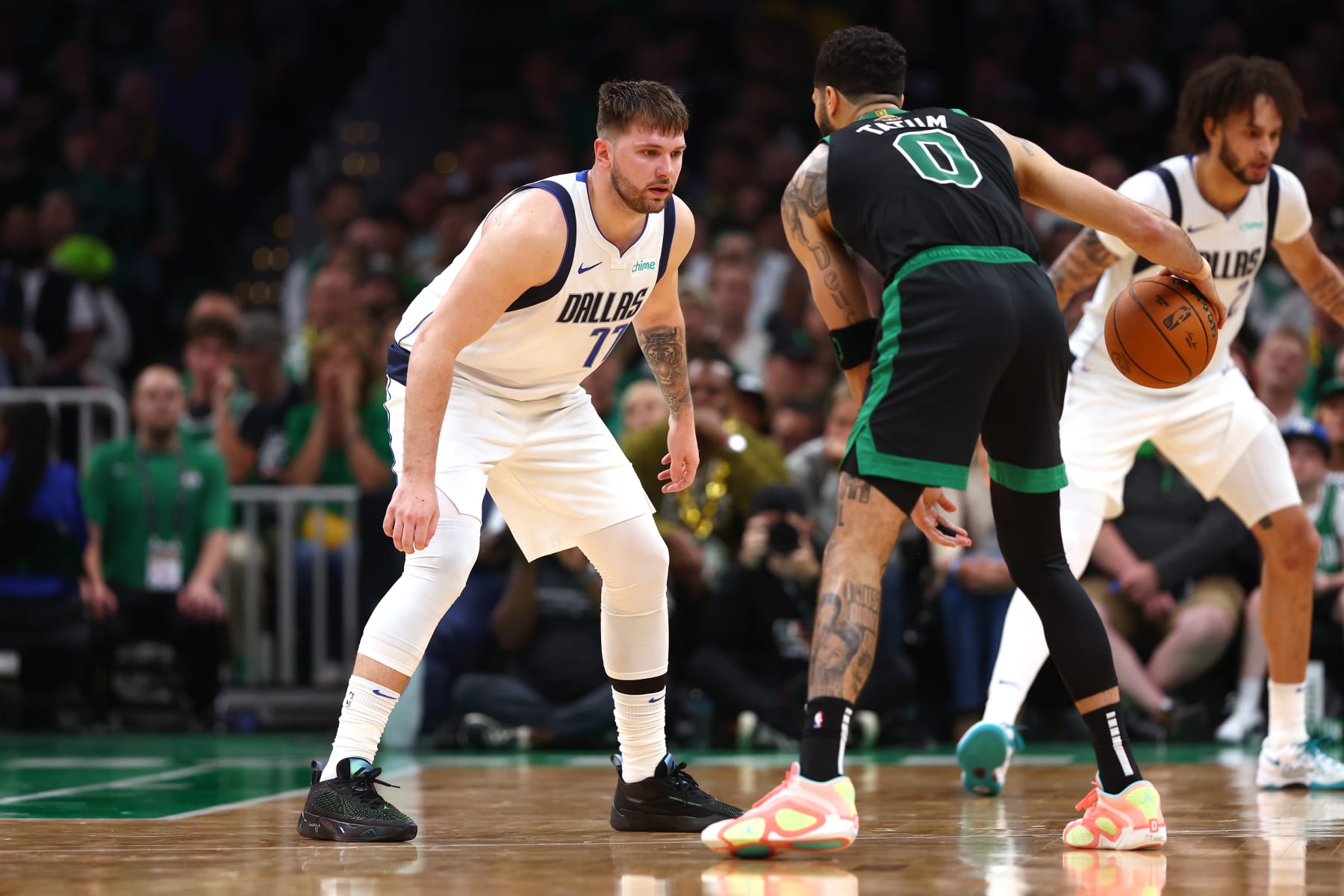 BOSTON, MASSACHUSETTS - JUNE 09: Luka Doncic #77 of the Dallas Mavericks defends against Jayson Tatum #0 of the Boston Celtics during the third quarter in Game Two of the 2024 NBA Finals at TD Garden on June 09, 2024 in Boston, Massachusetts. NOTE TO USER: User expressly acknowledges and agrees that, by downloading and or using this photograph, User is consenting to the terms and conditions of the Getty Images License Agreement. (Photo by Maddie Meyer/Getty Images)