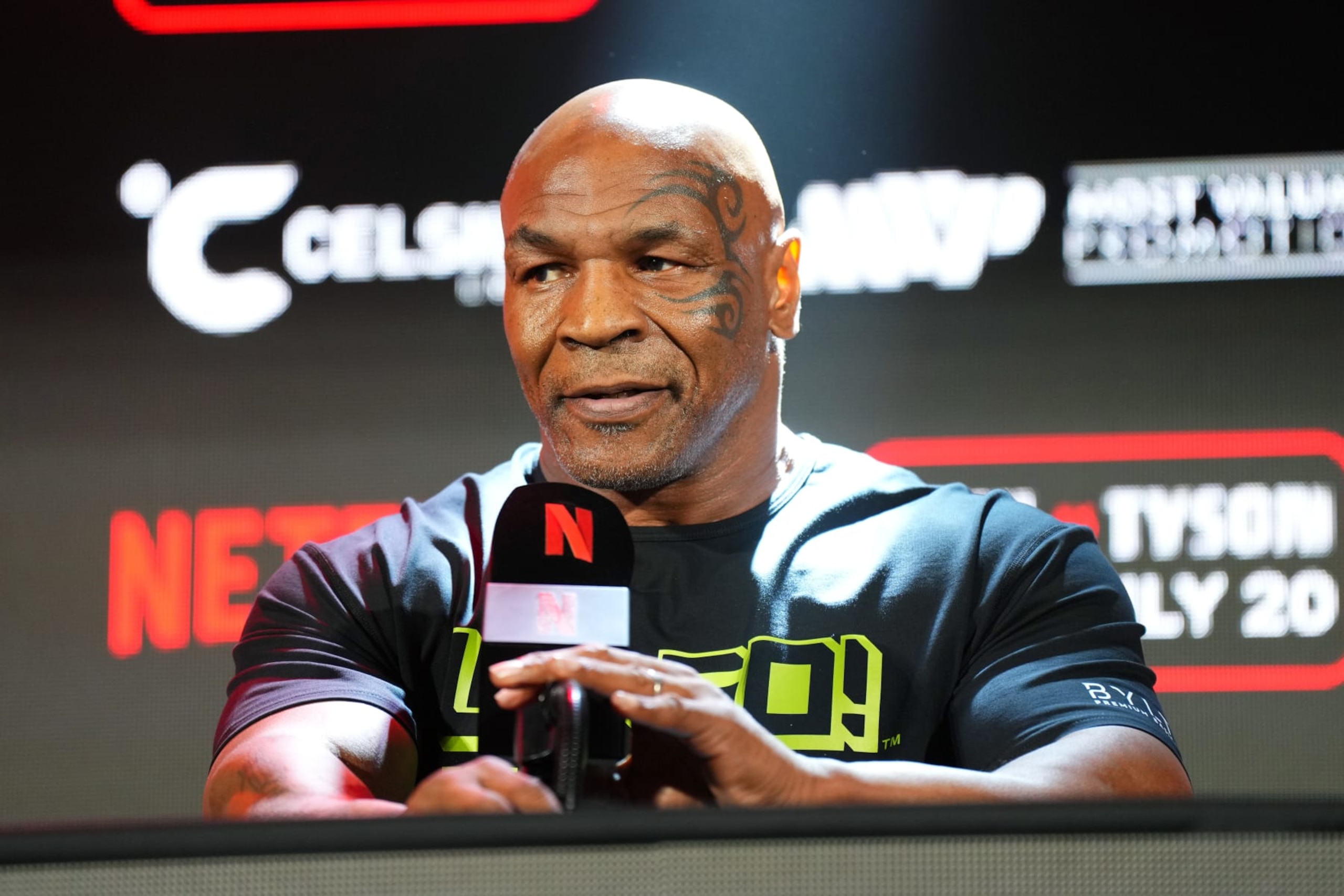 ARLINGTON, TEXAS - MAY 16: Mike Tyson speaks onstage during the Jake Paul vs. Mike Tyson Boxing match Arlington press conference at Texas Live! on May 16, 2024 in Arlington, Texas. (Photo by Cooper Neill/Getty Images for Netflix) ARLINGTON, TEXAS - MAY 16: Mike Tyson speaks onstage during the Jake Paul vs. Mike Tyson Boxing match Arlington press conference at Texas Live! on May 16, 2024 in Arlington, Texas. (Photo by Cooper Neill/Getty Images for Netflix)