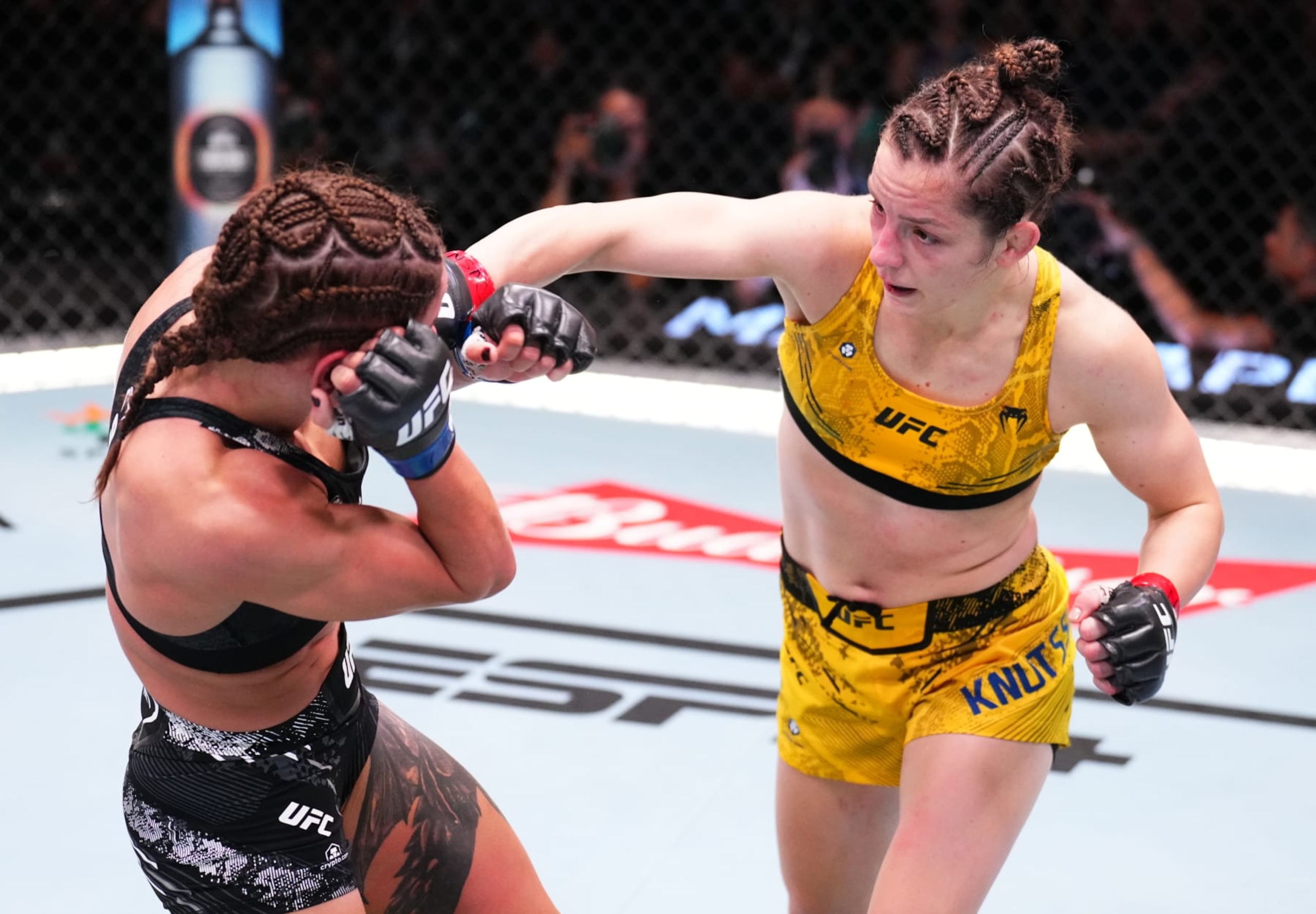 LAS VEGAS, NEVADA - JUNE 15: (R-L) Josefine Knutsson of Sweden punches Julia Polastri of Brazil in a strawweight fight during the UFC Fight Night event at UFC APEX on June 15, 2024 in Las Vegas, Nevada.  (Photo by Chris Unger/Zuffa LLC via Getty Images)