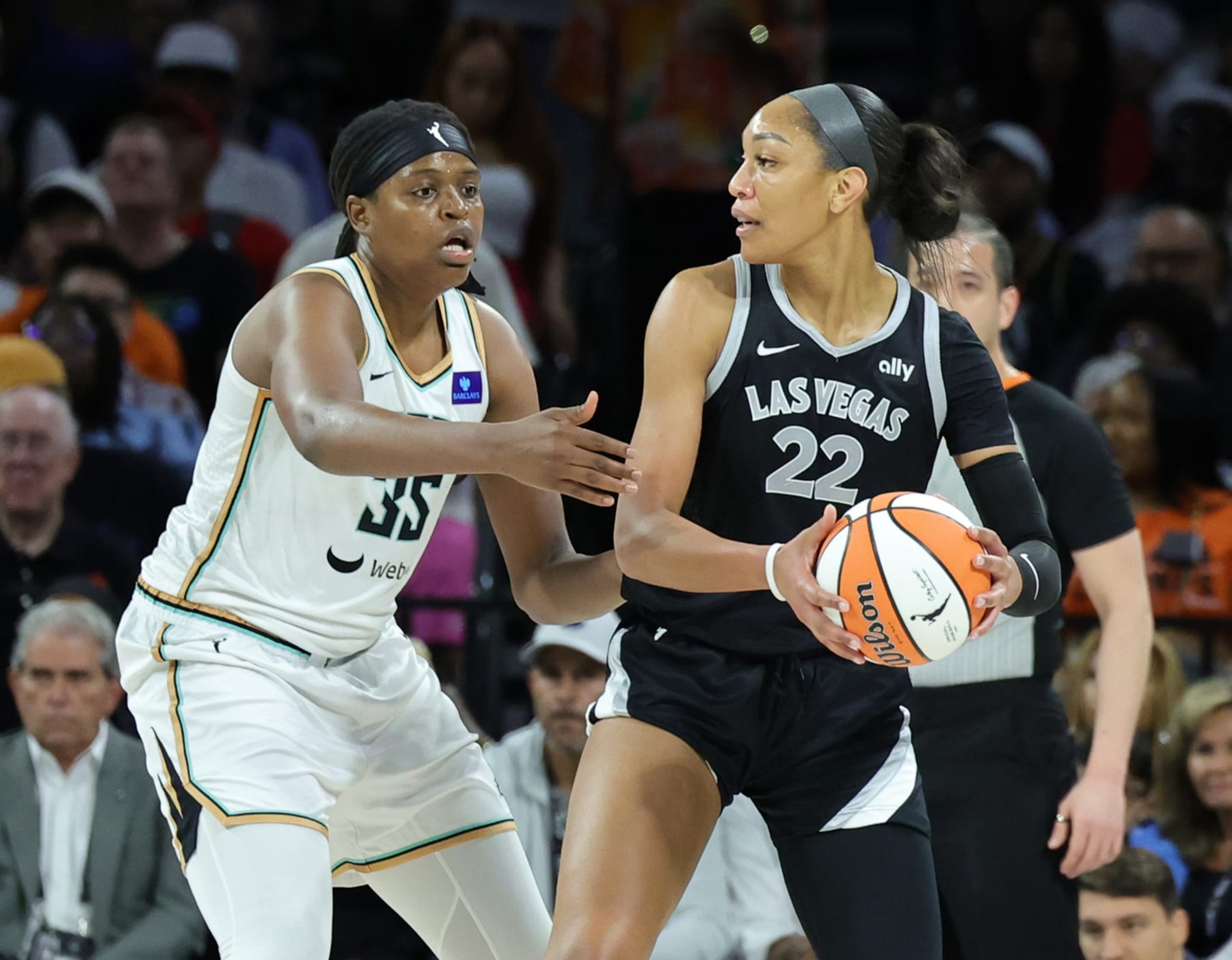 LAS VEGAS, NEVADA - JUNE 15: A'ja Wilson #22 of the Las Vegas Aces is guarded by Jonquel Jones #35 of the New York Liberty in the first quarter of their game at Michelob ULTRA Arena on June 15, 2024 in Las Vegas, Nevada. The Liberty defeated the Aces 90-82. NOTE TO USER: User expressly acknowledges and agrees that, by downloading and or using this photograph, User is consenting to the terms and conditions of the Getty Images License Agreement. (Photo by Ethan Miller/Getty Images) LAS VEGAS, NEVADA - JUNE 15: A'ja Wilson #22 of the Las Vegas Aces is guarded by Jonquel Jones #35 of the New York Liberty in the first quarter of their game at Michelob ULTRA Arena on June 15, 2024 in Las Vegas, Nevada. The Liberty defeated the Aces 90-82. NOTE TO USER: User expressly acknowledges and agrees that, by downloading and or using this photograph, User is consenting to the terms and conditions of the Getty Images License Agreement. (Photo by Ethan Miller/Getty Images)