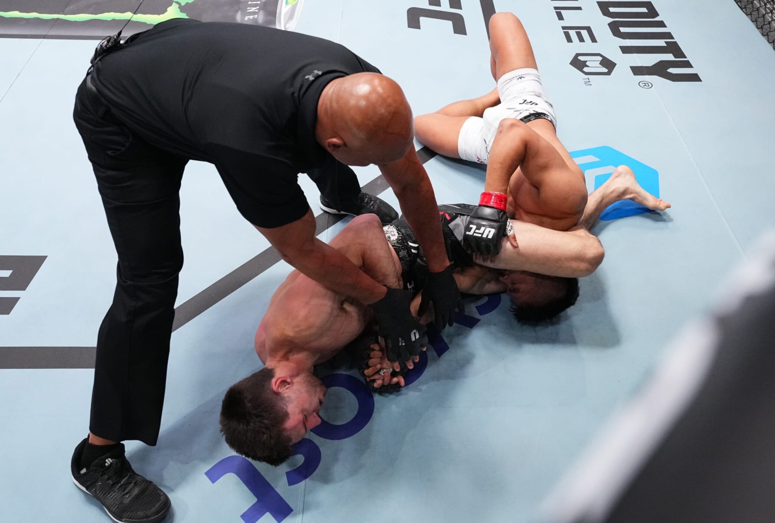 LAS VEGAS, NEVADA - JUNE 15: (L-R) Westin Wilson secures an arm bar submission against Jeka Saragih of Indonesia in a featherweight fight during the UFC Fight Night event at UFC APEX on June 15, 2024 in Las Vegas, Nevada.  (Photo by Chris Unger/Zuffa LLC via Getty Images)