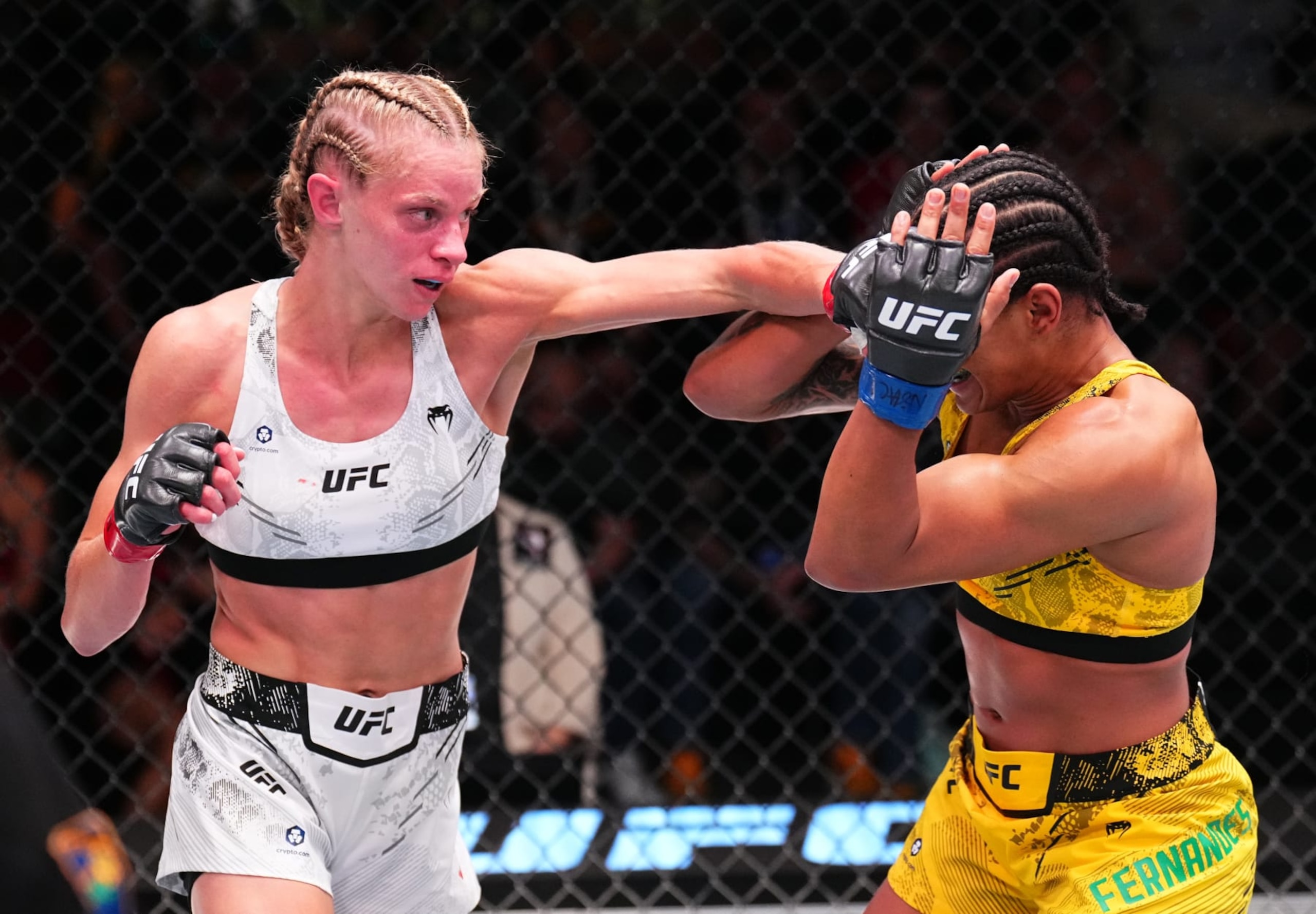 LAS VEGAS, NEVADA - JUNE 15: Carli Judice punches Gabriella Fernandes of Brazil in a flyweight fight during the UFC Fight Night event at UFC APEX on June 15, 2024 in Las Vegas, Nevada.  (Photo by Chris Unger/Zuffa LLC via Getty Images)