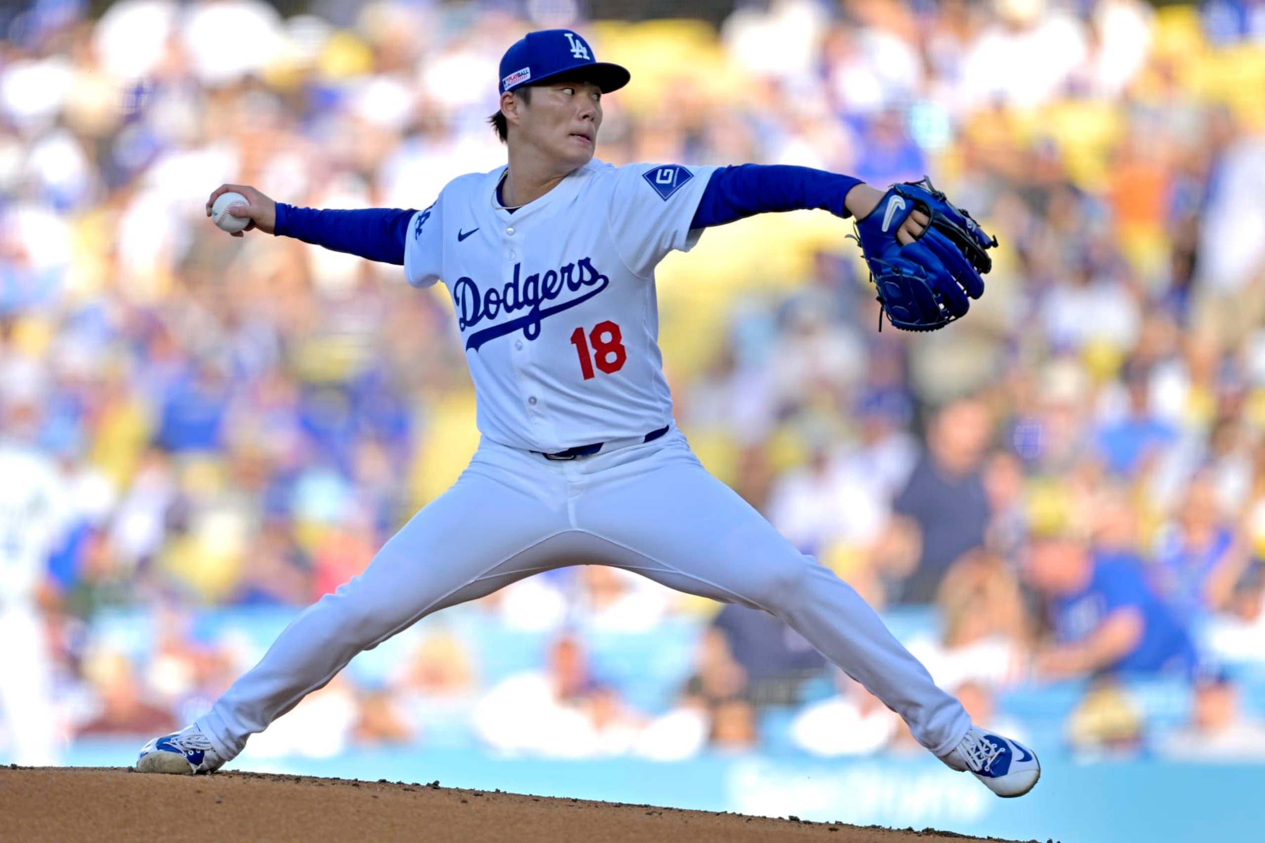 LOS ANGELES, CALIFORNIA - JUNE 15: Yoshinobu Yamamoto #18 of the Los Angeles Dodgers delivers to the plate in the second inning against the Kansas City Royals at Dodger Stadium on June 15, 2024 in Los Angeles, California. (Photo by Jayne Kamin-Oncea/Getty Images)
