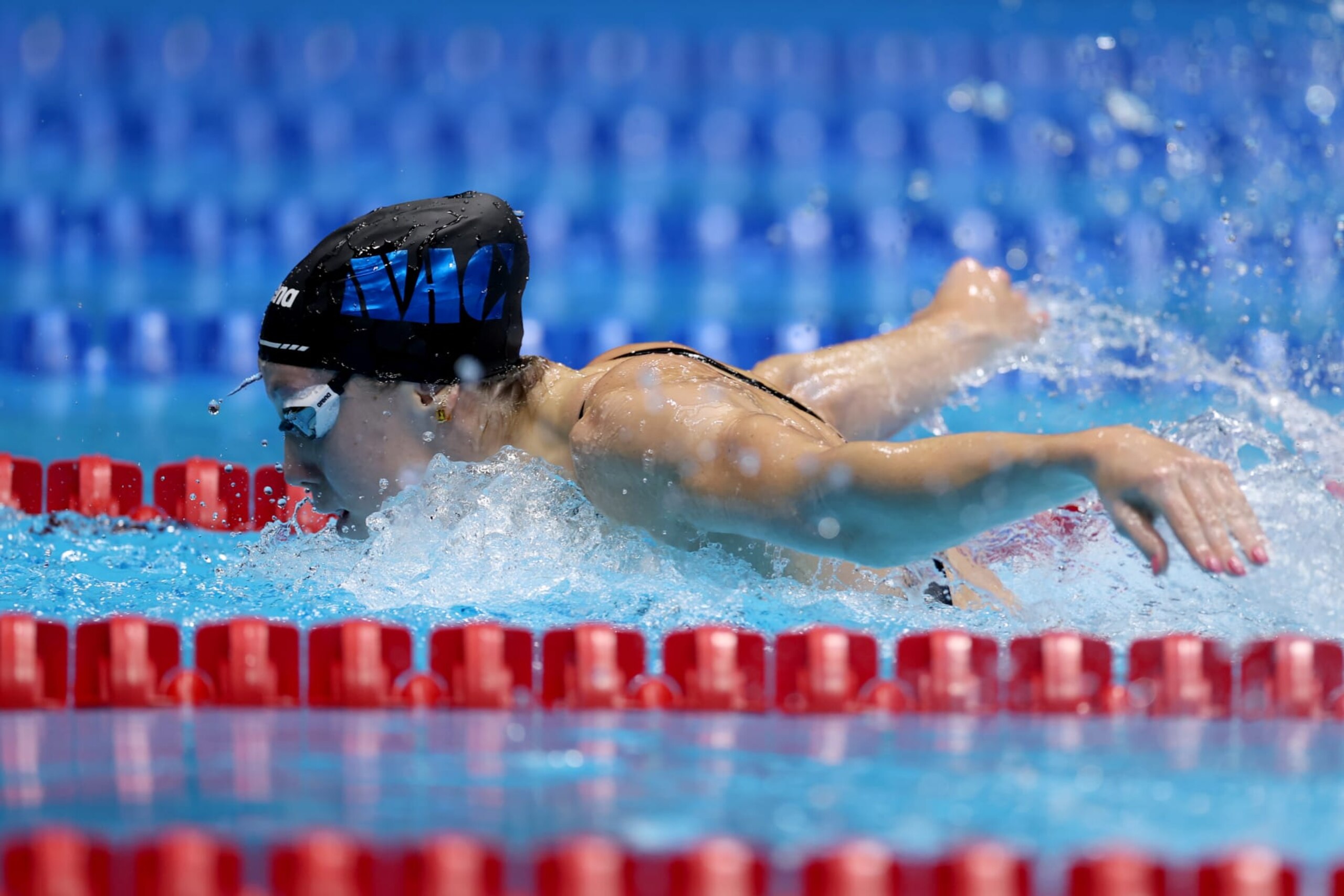 INDIANAPOLIS, INDIANA - JUNE 15: Gretchen Walsh of the United States competes in a preliminary heat for the Women's 100m butterfly on Day One of the 2024 U.S. Olympic Team Swimming Trials at Lucas Oil Stadium on June 15, 2024 in Indianapolis, Indiana. (Photo by Al Bello/Getty Images)