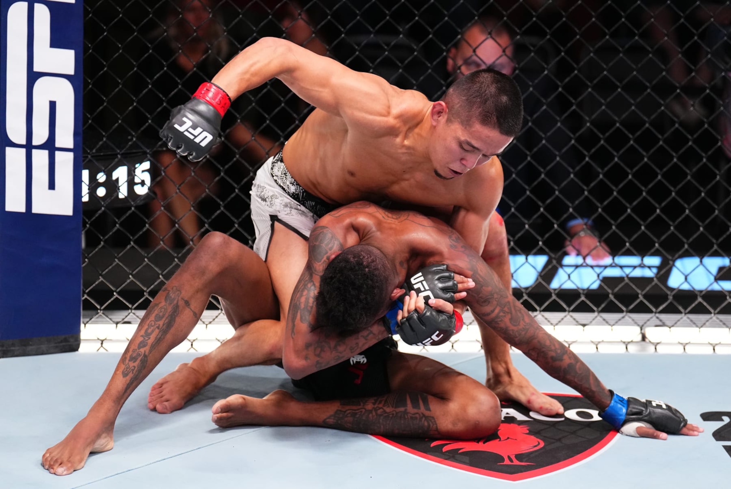 LAS VEGAS, NEVADA - JUNE 15: (L-R) Asu Almabayev of Kazakstan battles Jose Johnson in a flyweight fight during the UFC Fight Night event at UFC APEX on June 15, 2024 in Las Vegas, Nevada.  (Photo by Chris Unger/Zuffa LLC via Getty Images)