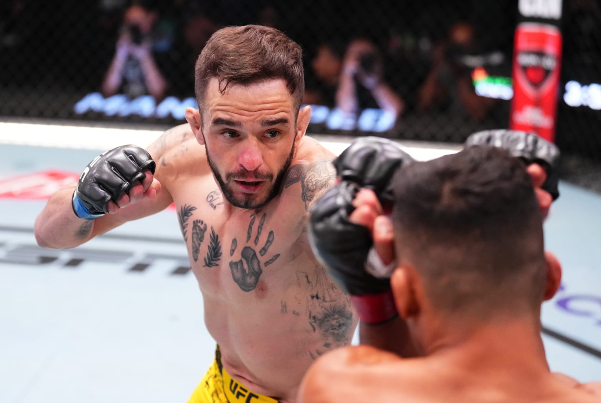 LAS VEGAS, NEVADA - JUNE 15: (L-R) Lucas Almeida of Brazil punches Timmy Cuamba in a featherweight fight during the UFC Fight Night event at UFC APEX on June 15, 2024 in Las Vegas, Nevada.  (Photo by Chris Unger/Zuffa LLC via Getty Images)