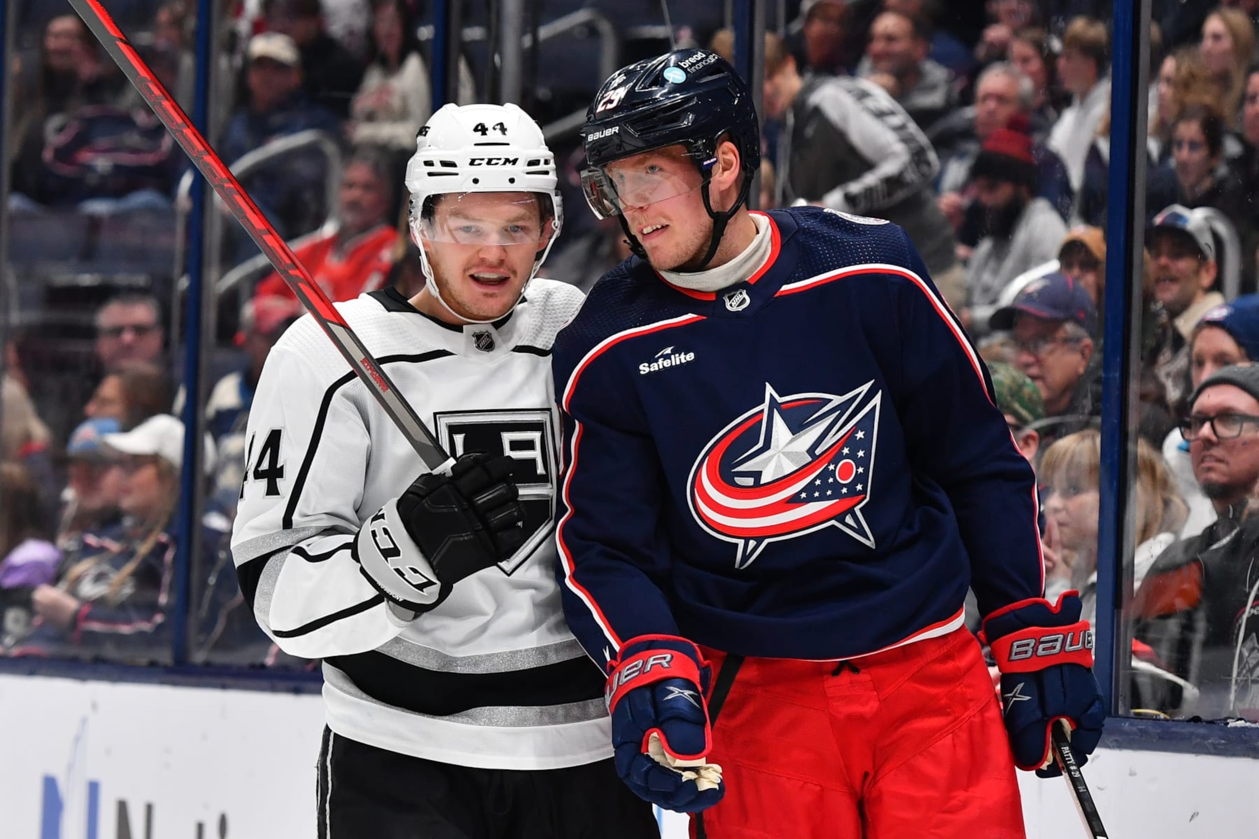 COLUMBUS, OHIO - DECEMBER 11: Mikey Anderson #44 of the Los Angeles Kings and Patrik Laine #29 of the Columbus Blue Jackets talk during the third period of a game at Nationwide Arena on December 11, 2022 in Columbus, Ohio. (Photo by Ben Jackson/NHLI via Getty Images)