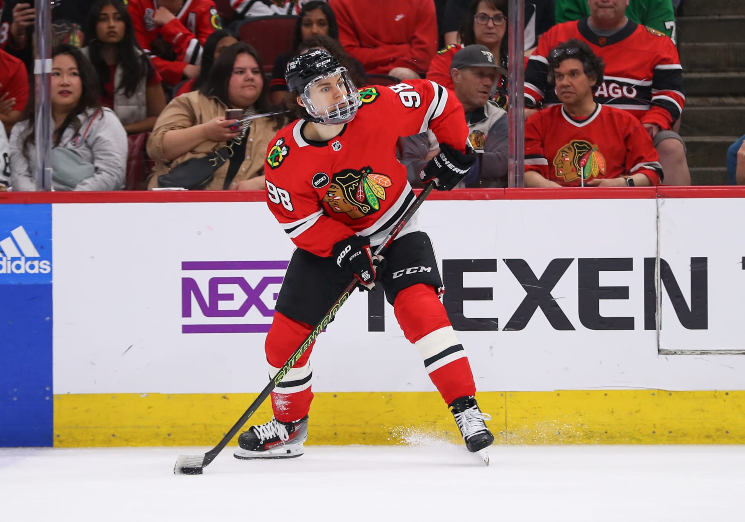 CHICAGO, IL - APRIL 14: Connor Bedard #98 of the Chicago Blackhawks controls the puck during the third period against the Carolina Hurricanes at the United Center on April 14, 2024 in Chicago, Illinois. (Photo by Melissa Tamez/Icon Sportswire via Getty Images)