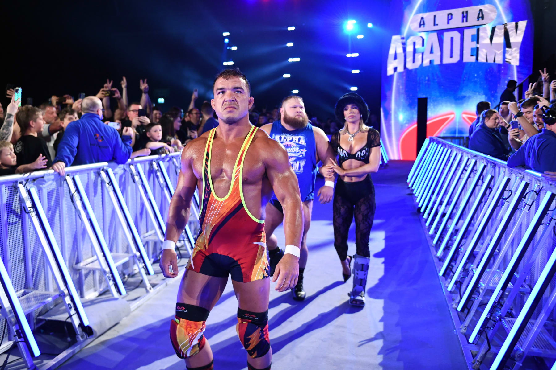 GLASGOW, SCOTLAND - JUNE 15: Chad Gable, Otis and Maxine Duper of the Alpha Academy make their entrance for Gable's WWE Intercontinental Title match against Sami Zayn (not pictured) during WWE's Clash at the Castle, Premium Live Event at The OVO Hydro on June 15, 2024 in Glasgow, Scotland.  (Photo by WWE/Getty Images)